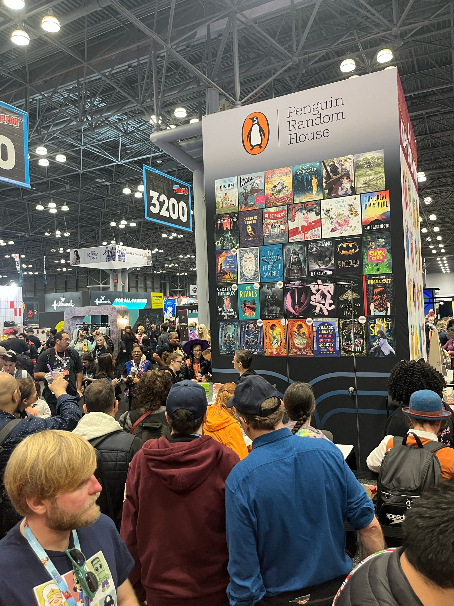 Getting started signing at the Penguin Random House booth at NYCC.