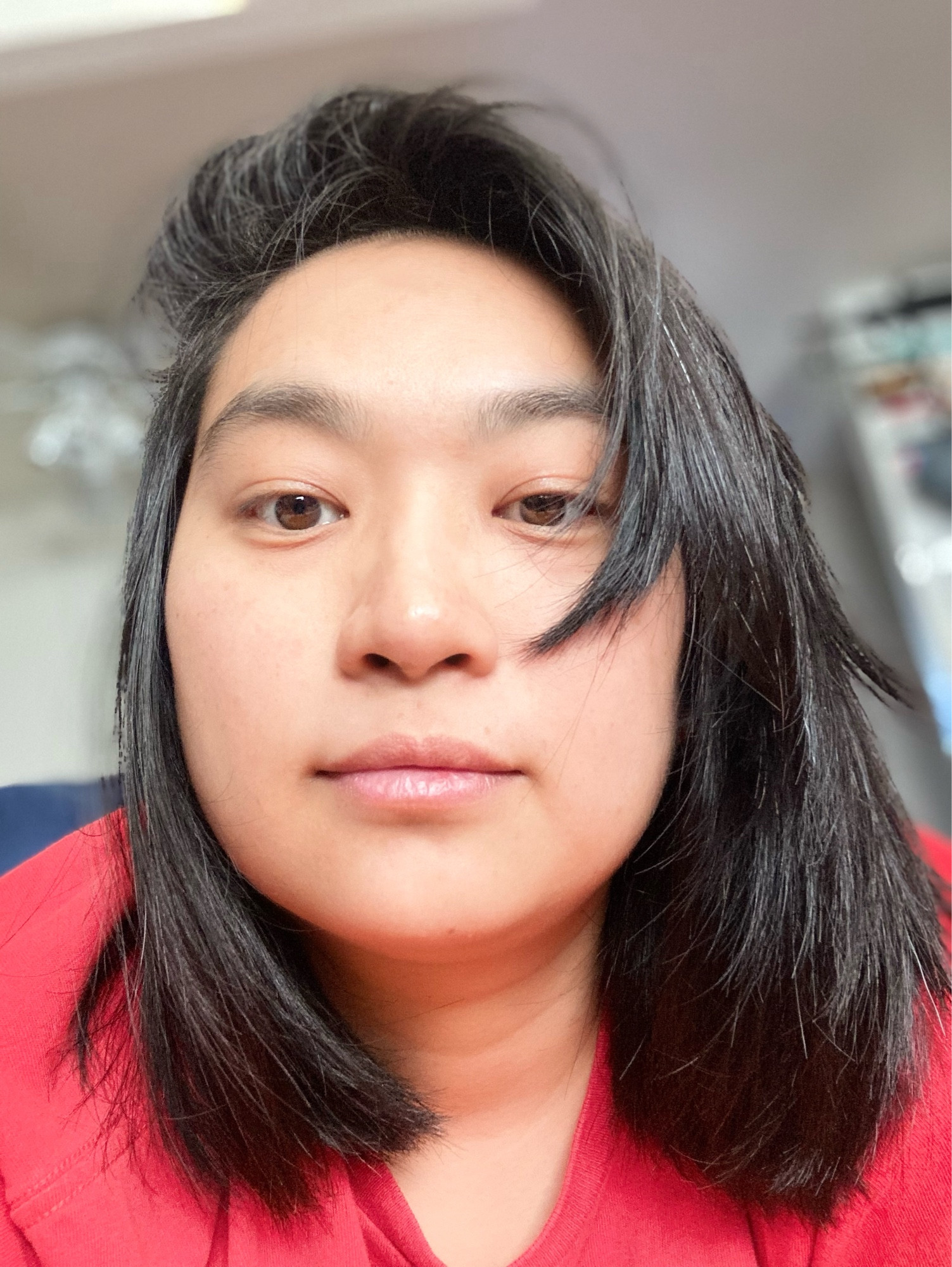 selfies of nonbinary Asian person, indoors with good lighting, no glasses, red T-shirt