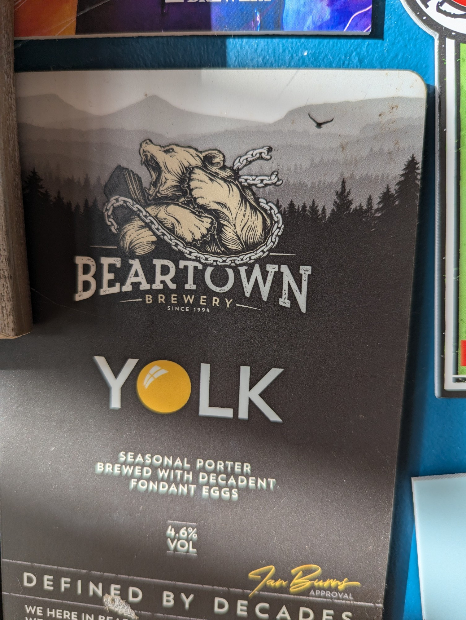 A large beermat for a beer named YOLK that's 'brewed with decadent fondant eggs'