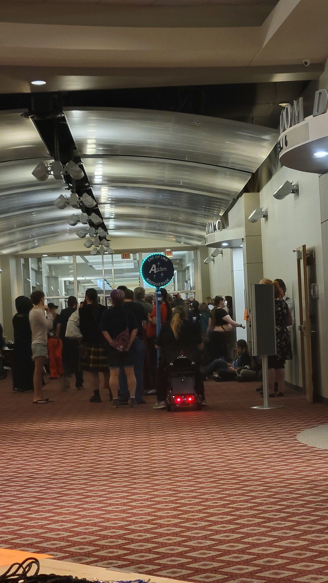 Line of sci-fi convention attendees waiting for the annual masquerade seating to open