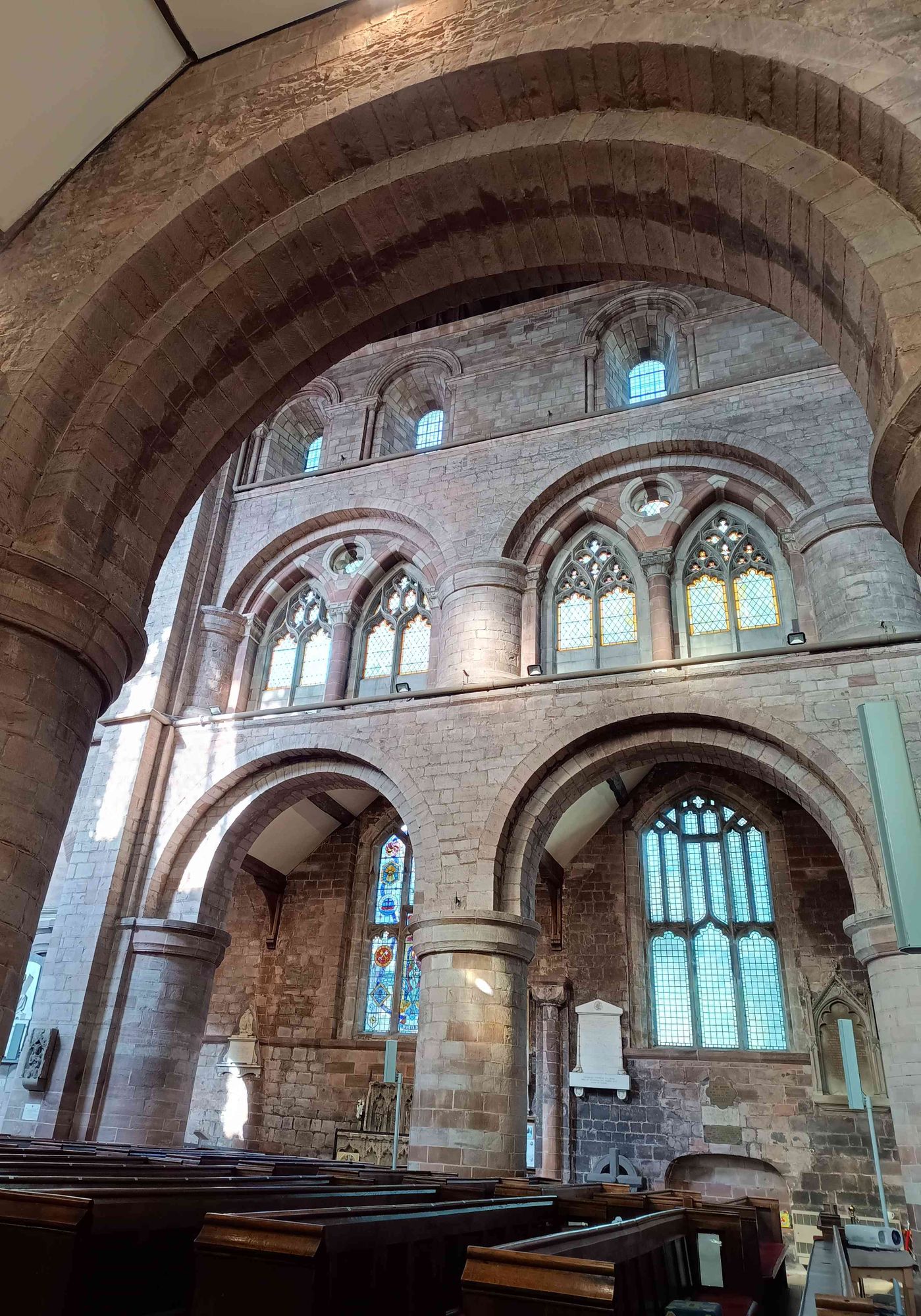 A photo looking across the nave showing the Romanesque pillars