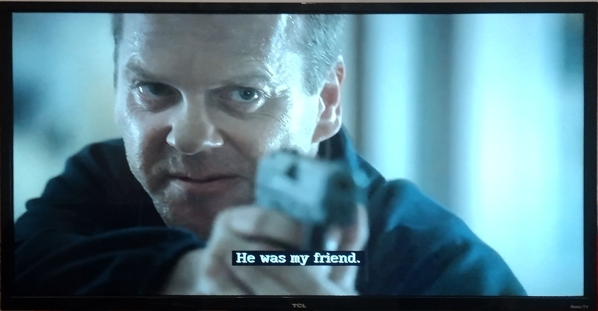 Jack Bauer pointing a gun at Wayne Palmer with the statement "He was my friend." 24 S5E2