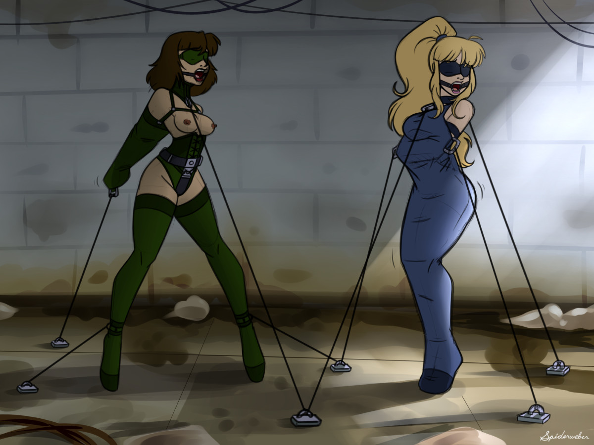 two women are bound and gagged, chained to the floor of a dark basement, while being gagged, blindfolded, and in leather bondage gear, with the short haired brunette, Bree, in ballet boots, a corset, and armbinder, and the blonde with a long ponytail, Amber, in a full sleepsack attire.