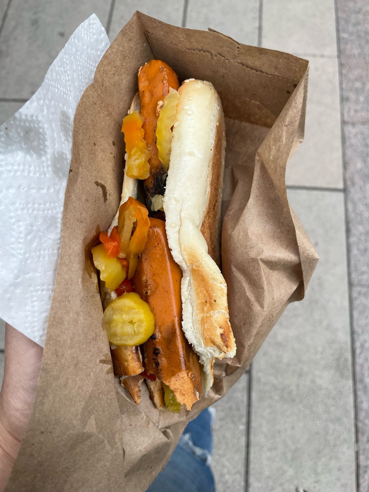 Picture of two veggie dogs in fresh, squishy bun with hot peppers