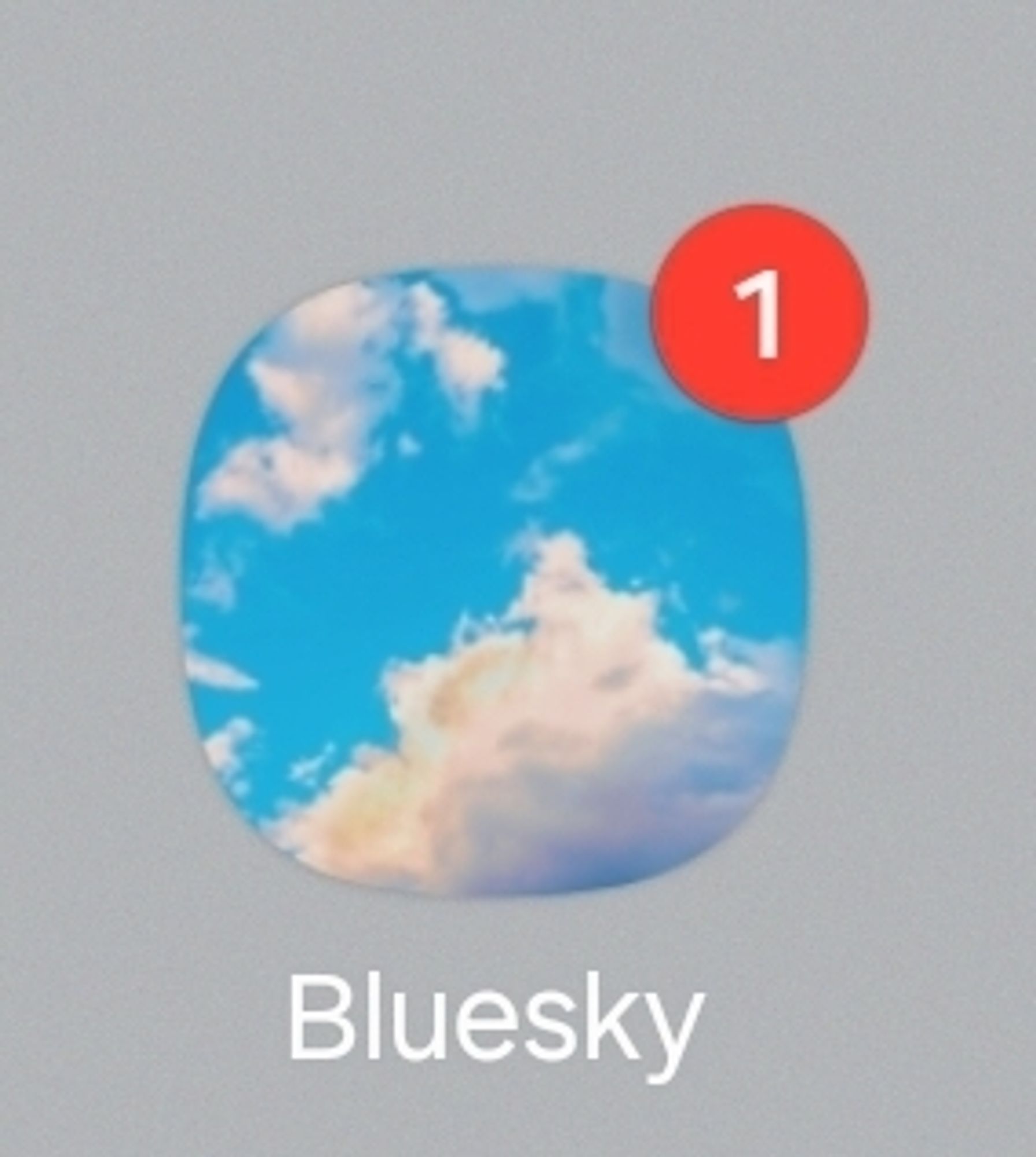 the bluesky app icon with a notification indicator