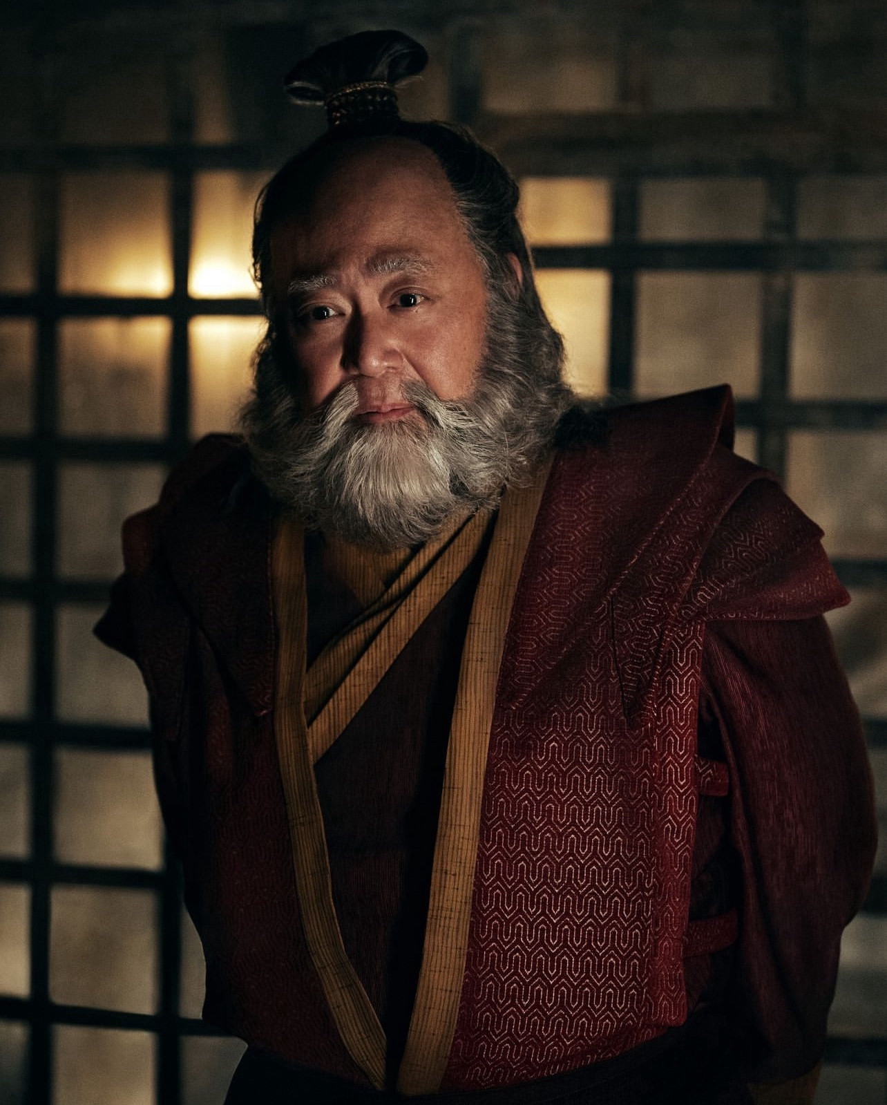 Paul Sun-Hyung Lee in costume as Uncle Iroh with trademark topknot and beard