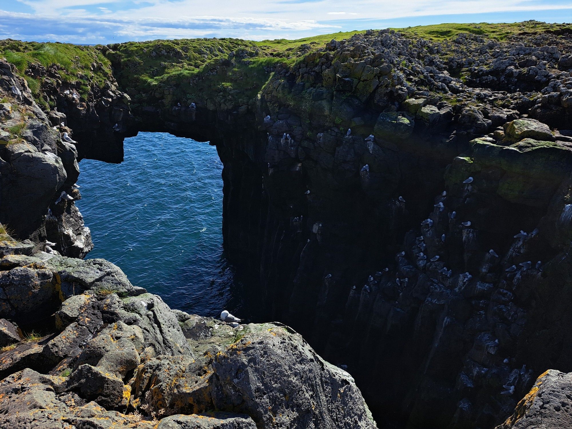 Cliffs with arc in Snaesfellnes Peninsula, Iceland.