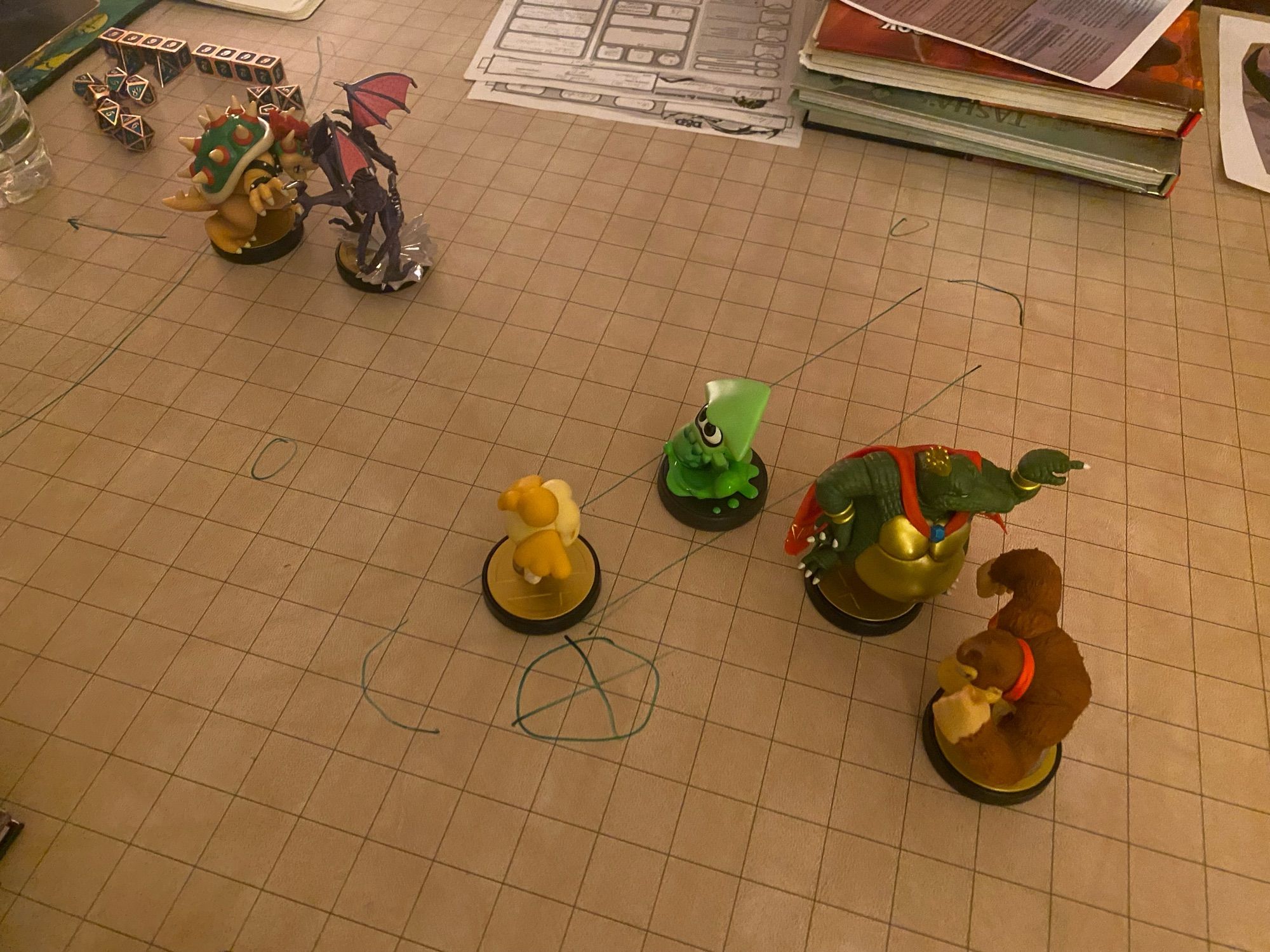 Smash bros amiibos fighting on a table top RPG mat. Bowser VS Ridley. Isabelle VS Squidling. King K. Rool VS DK.