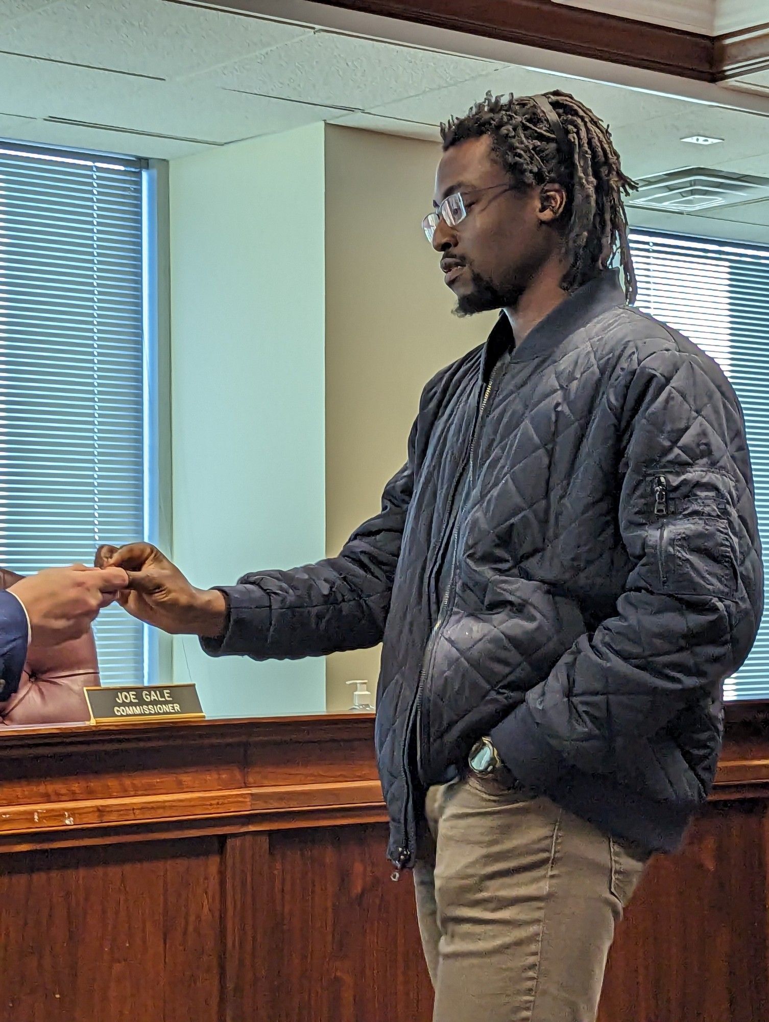 Towamencin Township supervisor-elect Kofi Osei picking the number that got him the job.