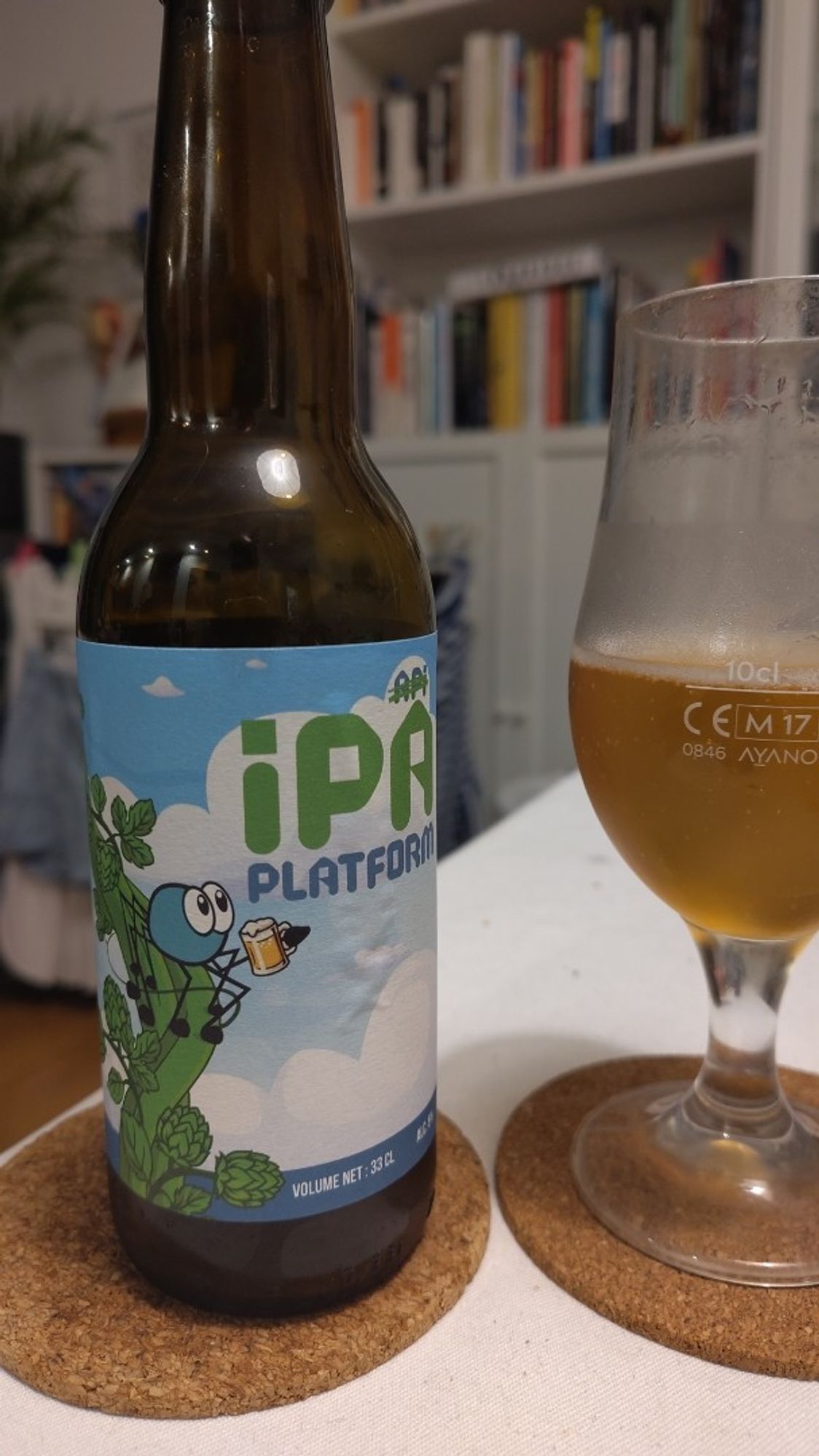 A bottle of IPA Platform Beer, with a spider mascot on it. 