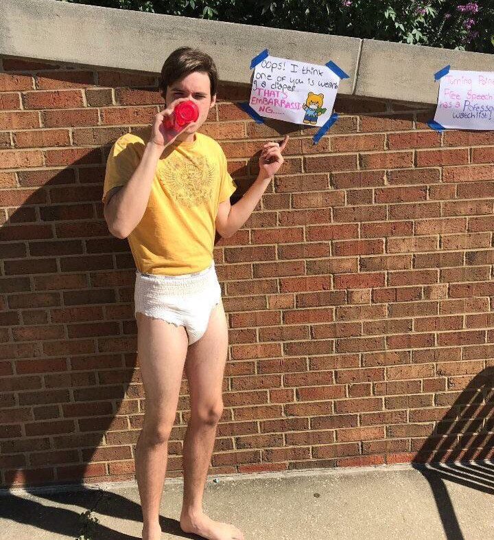 Charlie Kirk in a diaper drinking from a sippy cup. Actual photo. 
