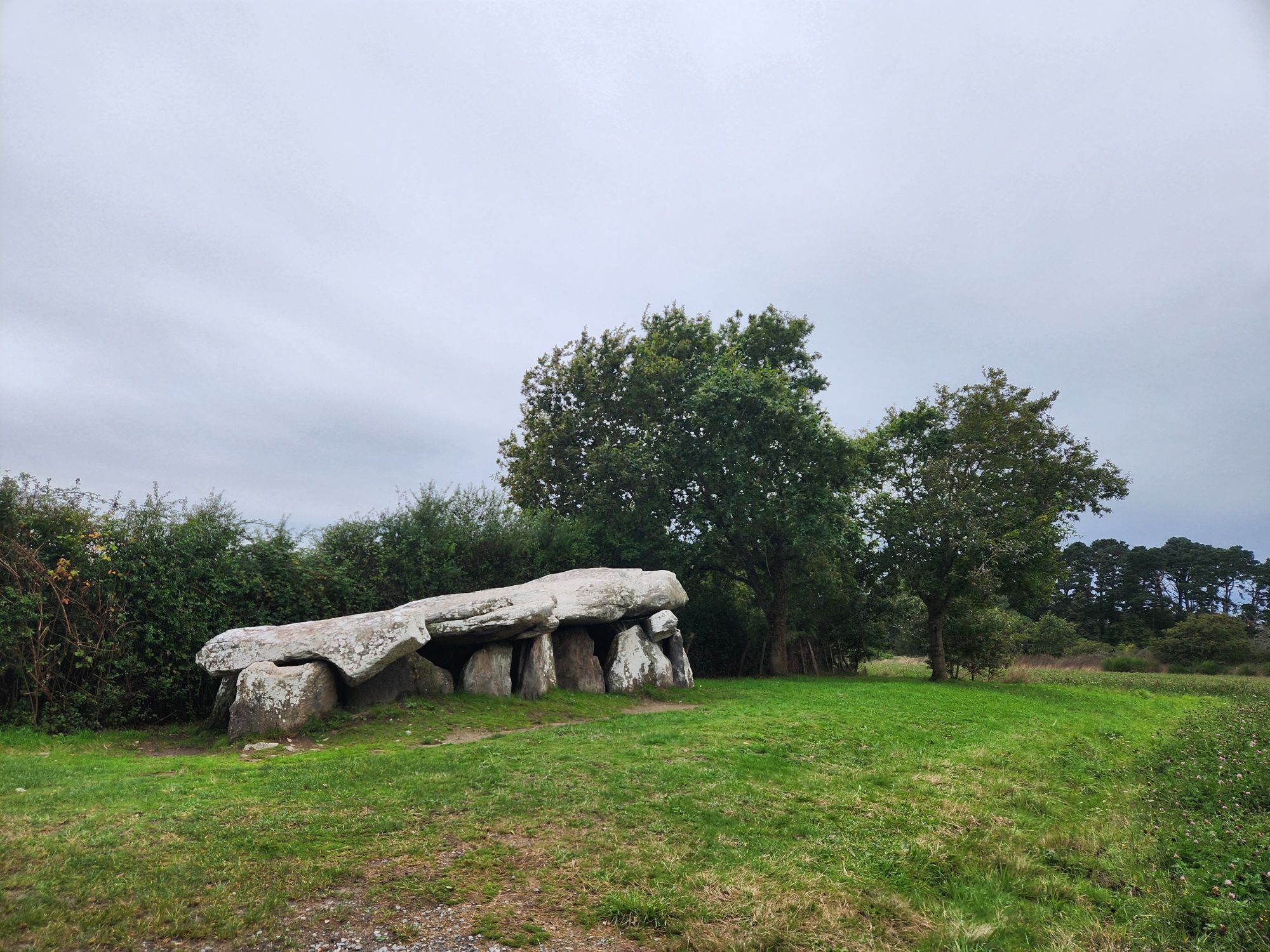 A large stone propped on other smaller, but still pretty large, stones