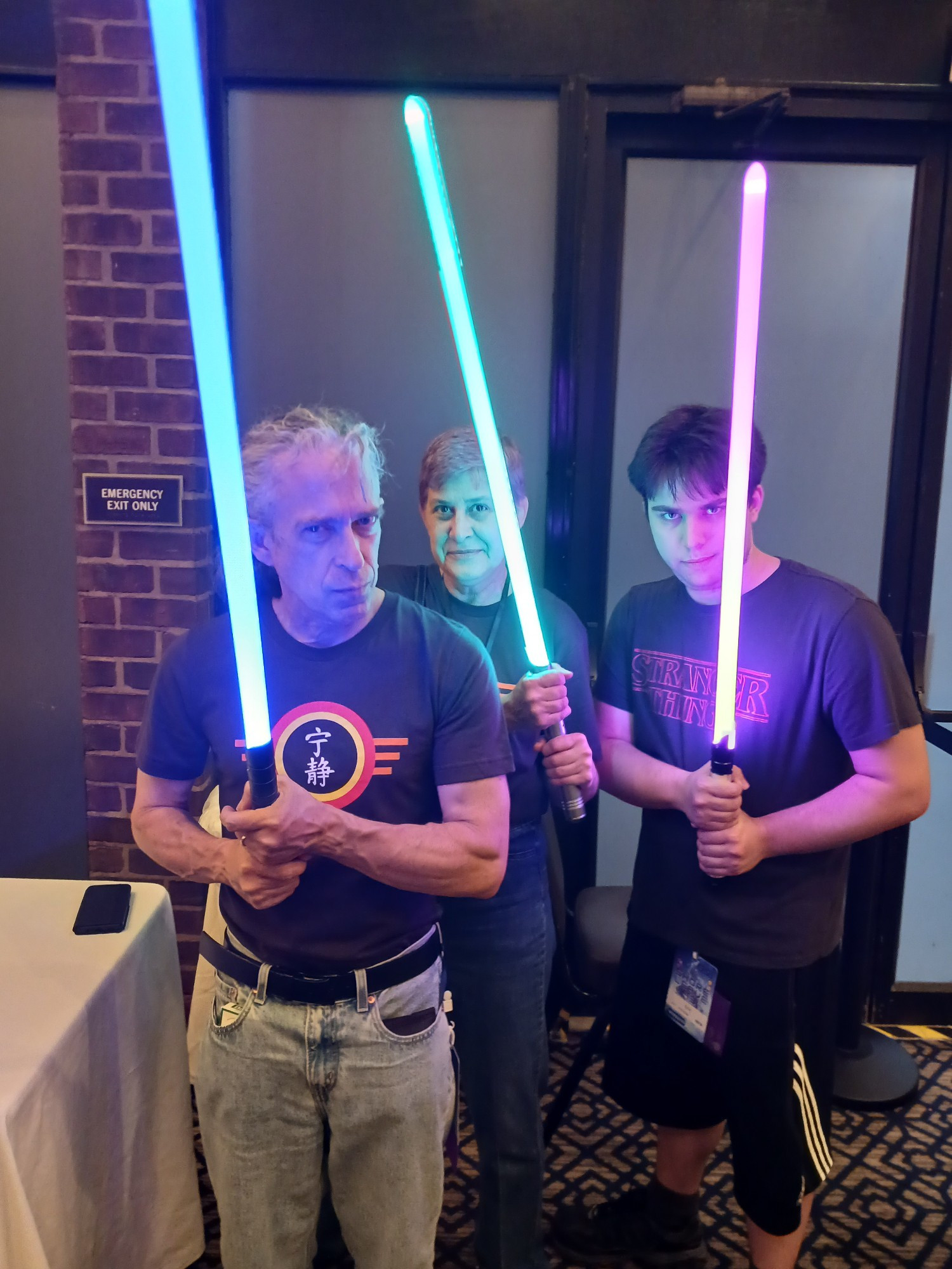 A photo of me with my wife and our son holding lightsabers. May the fourth be with you.