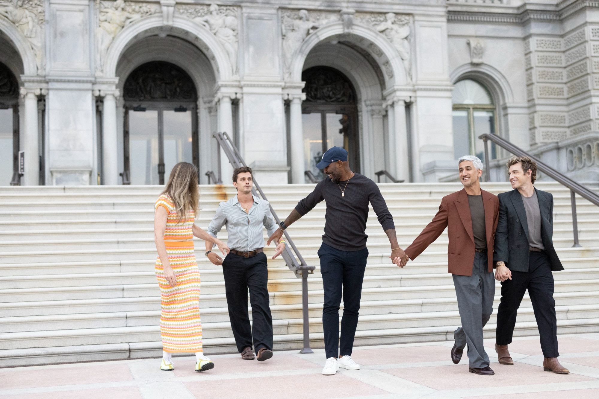 Left to right, Jonathan, Antoni, Karamo, Tan and Jeremiah of the hit show "Queer Eye" walk down the stairs and onto the patio in front of the Library of Congress' Jefferson Building.