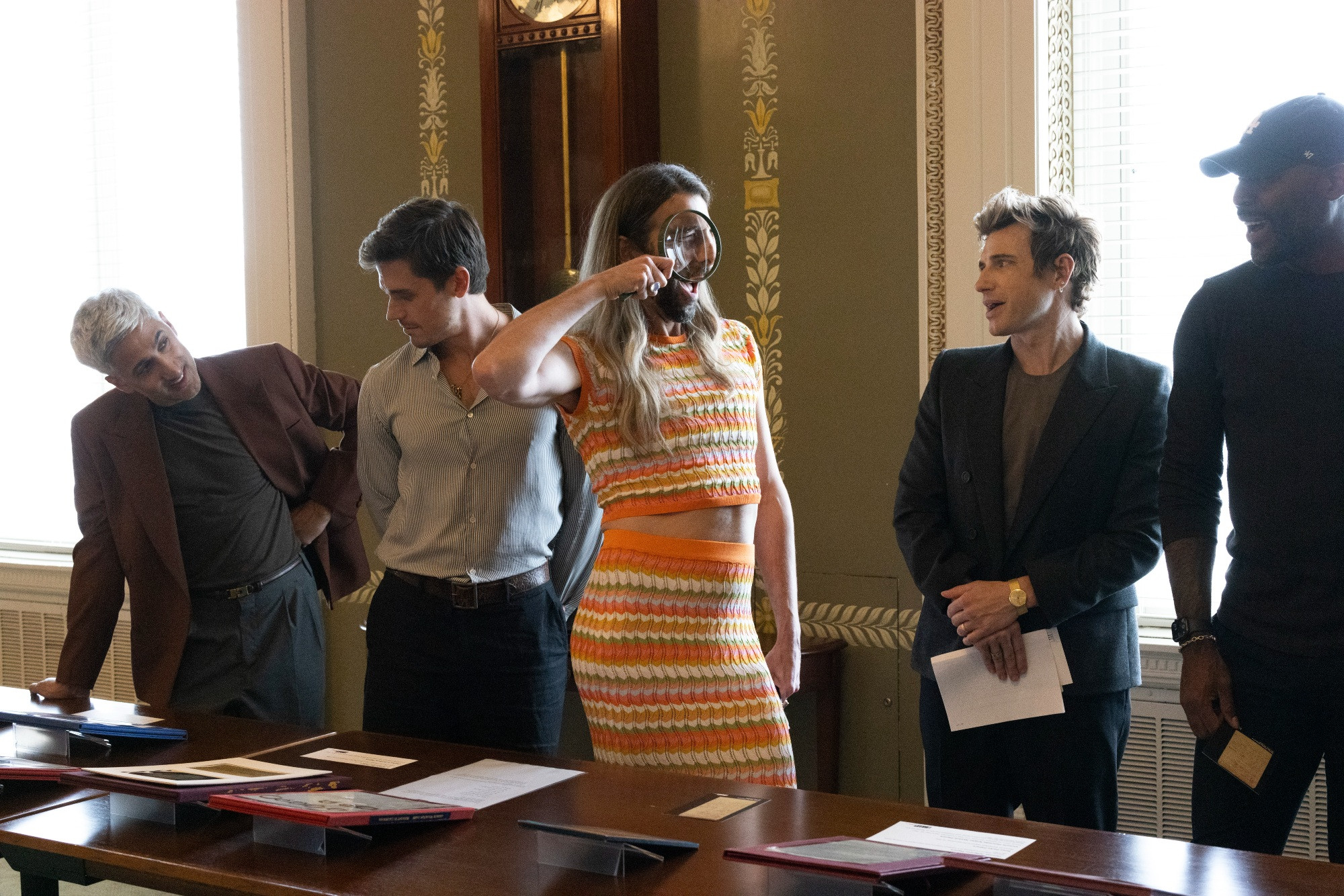 Left to right, Tan, Antoni, Jonathan, Jeremiah and Karamo look at a collections display inside a room at the Library of Congress.