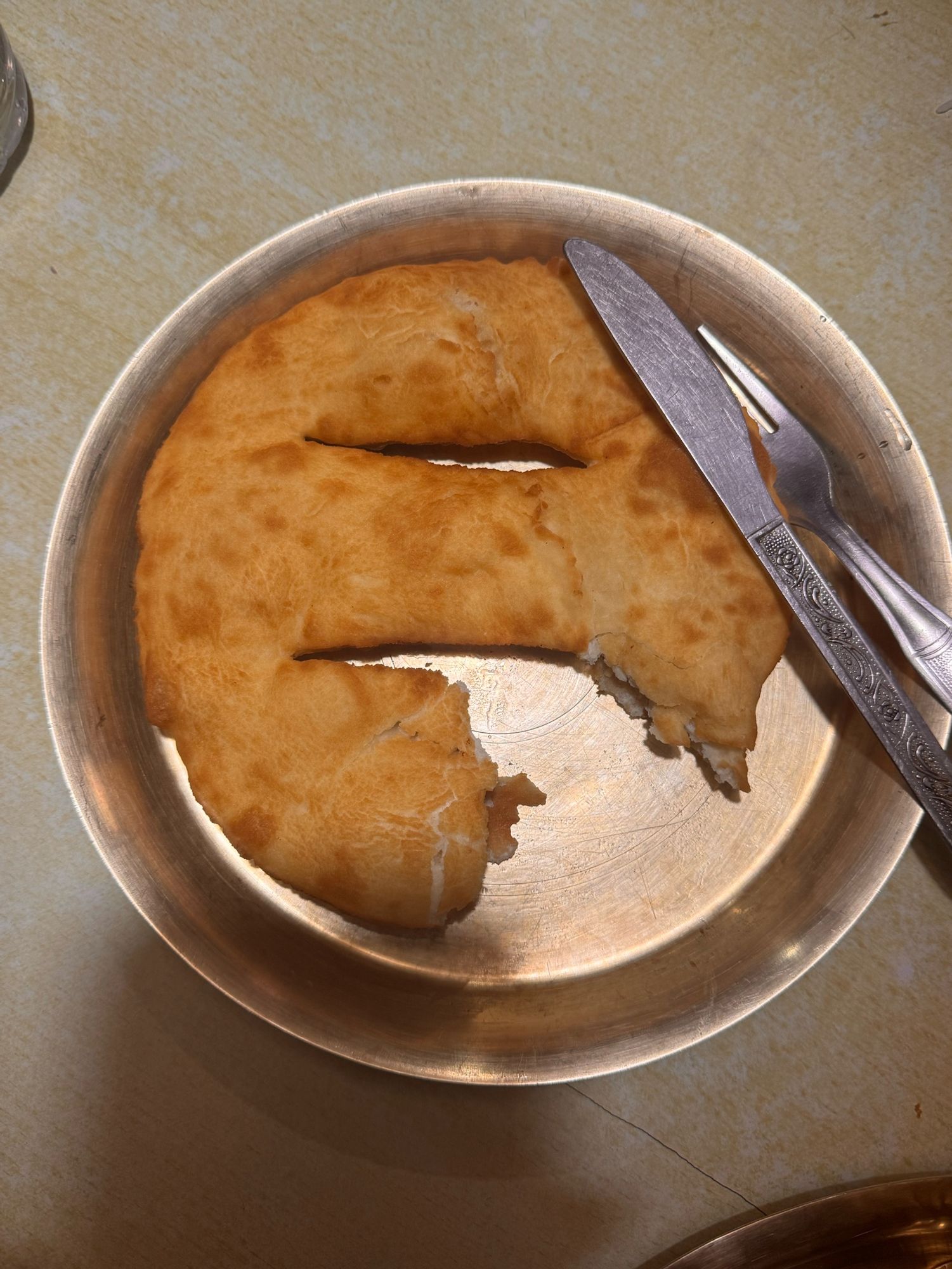 Gurung bread or Tibetan bread is found in the Gandaki region of Nepal 🇳🇵. This is where the Annarpuna mountains are located.
The bread is round and flat with two little slits in the middle. It’s crispy on the outside and soft in the middle. It looks golden brown and so delicious. I just wanted to eat it all the time 🤣. 