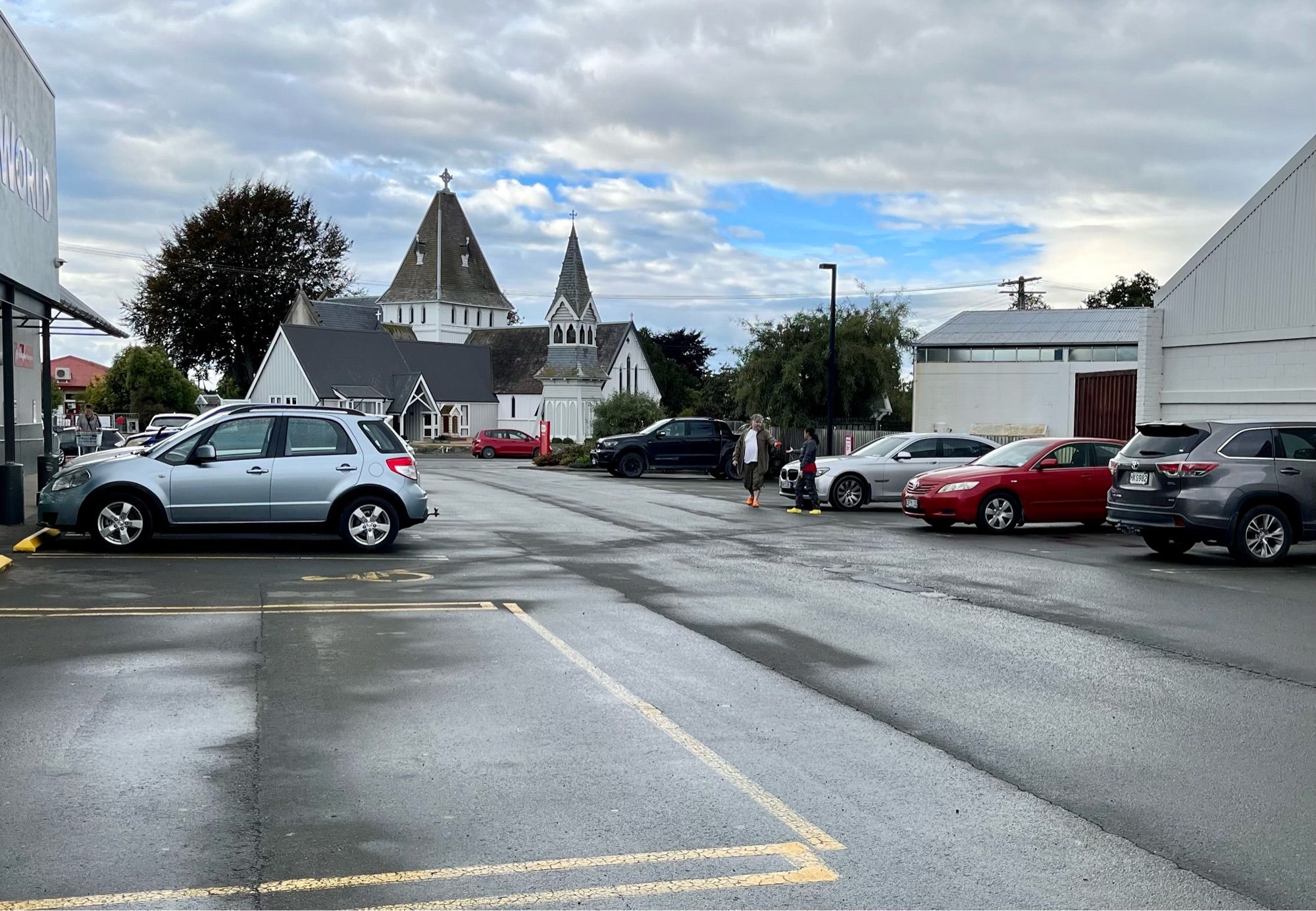 Cold wet cap park with an Anglican Church in the background.