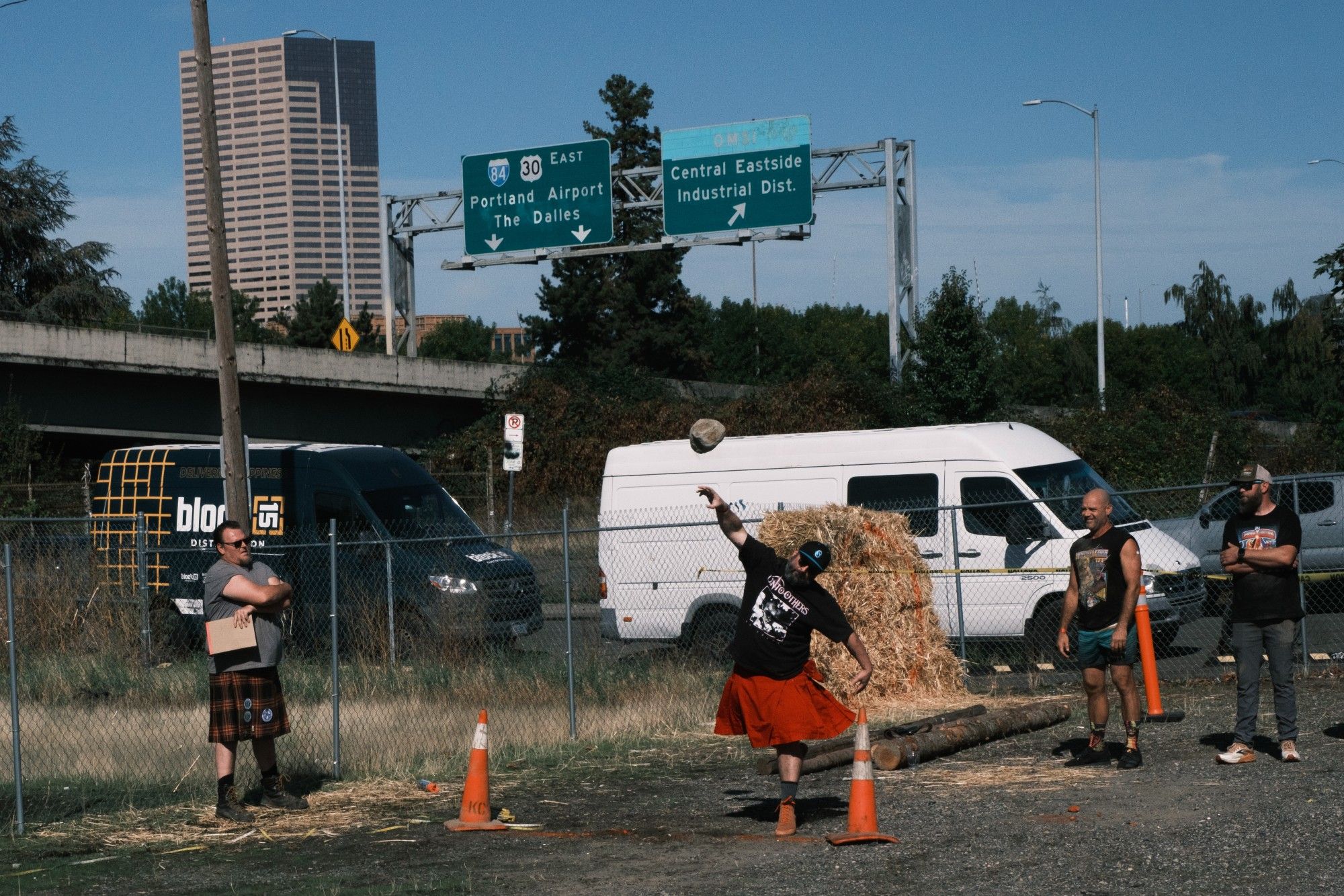 A man wearing a kilt throwing a large rock at the World Sausagefest and Heavy Games in SE Portland.