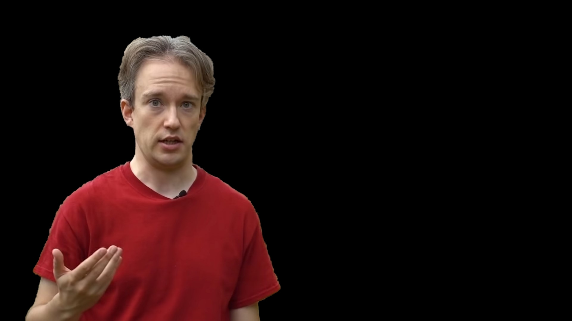 Tom scott on a transparent background, looking like he's explaining something about the place that'd normally be behind him