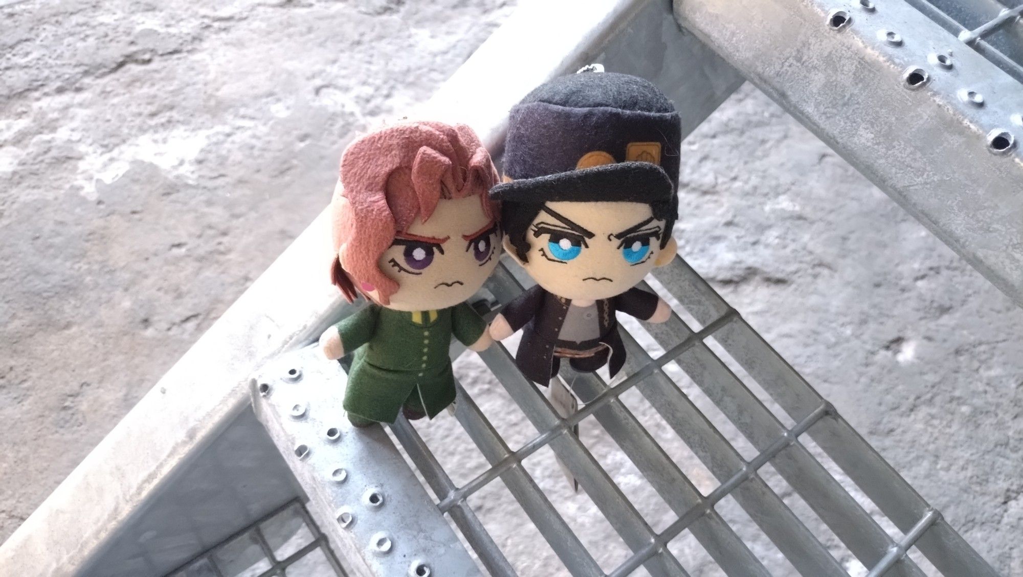 Kakyoin and Jotaro on a metal staircase