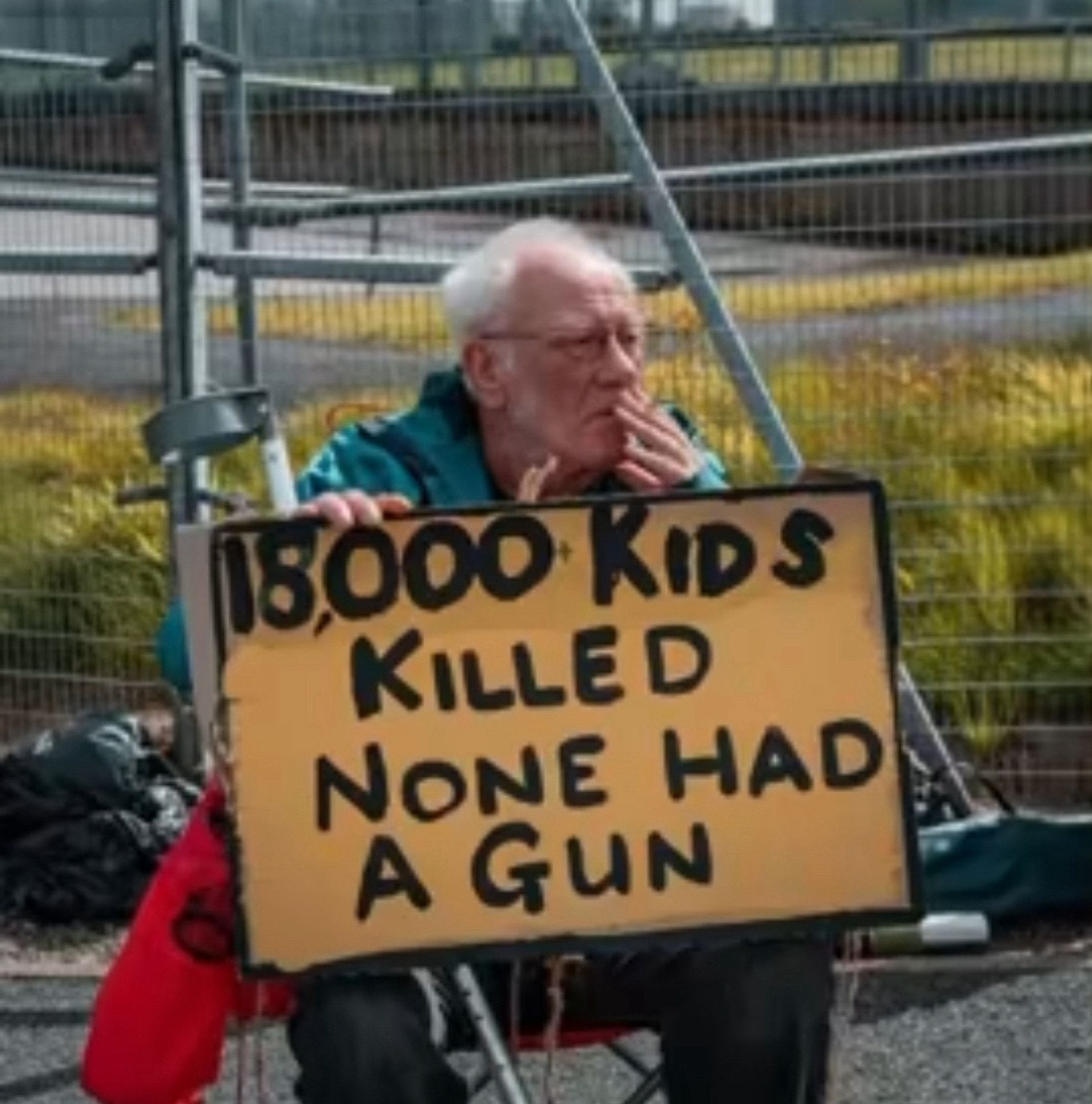 Elderly British man in wheel chair joins Palestinian protesters in  Blackburn, UK.” 

His sign says : 15,000 KIDS KILLED
NONE HAD A GUN