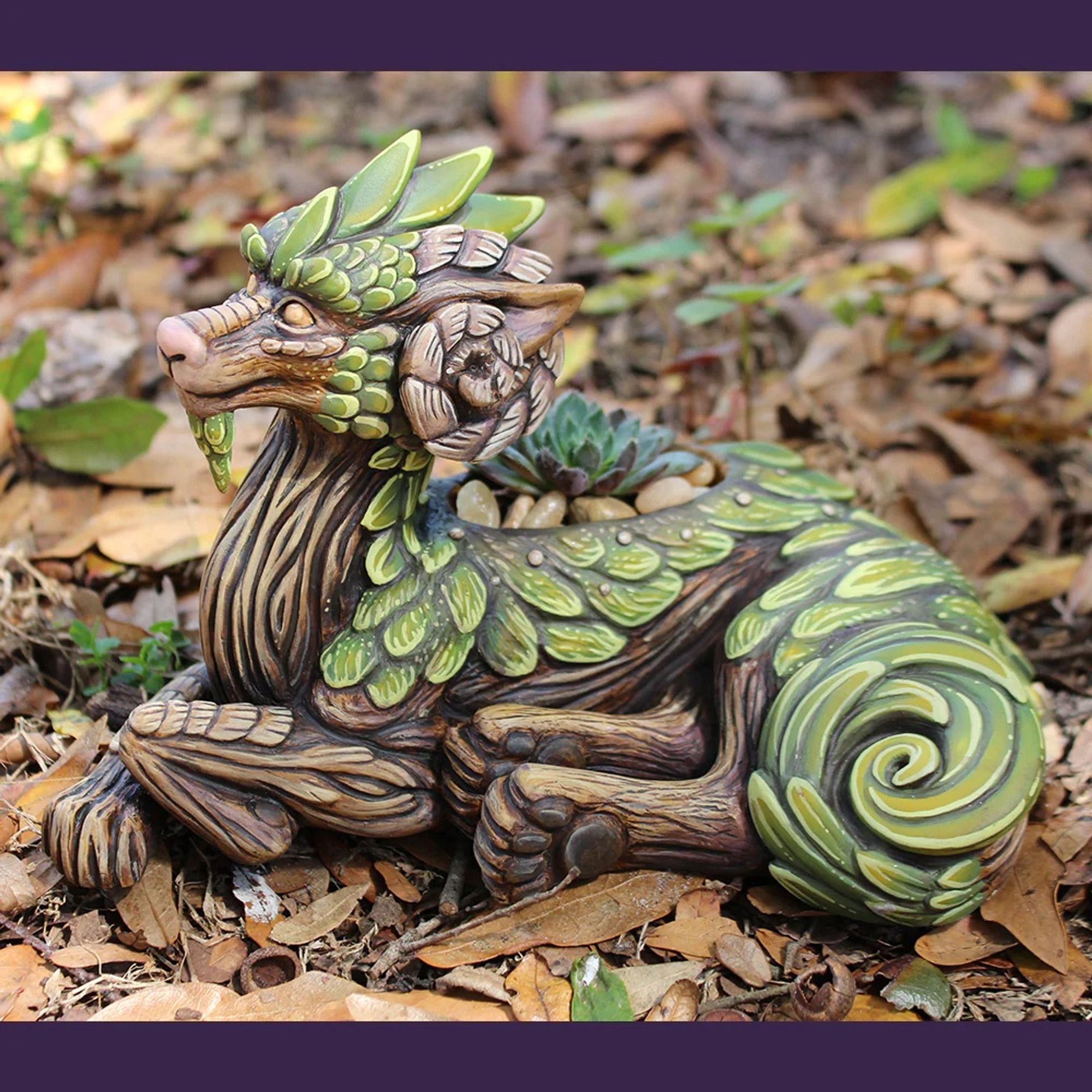 A mossy tree themed dragon that is a planter.