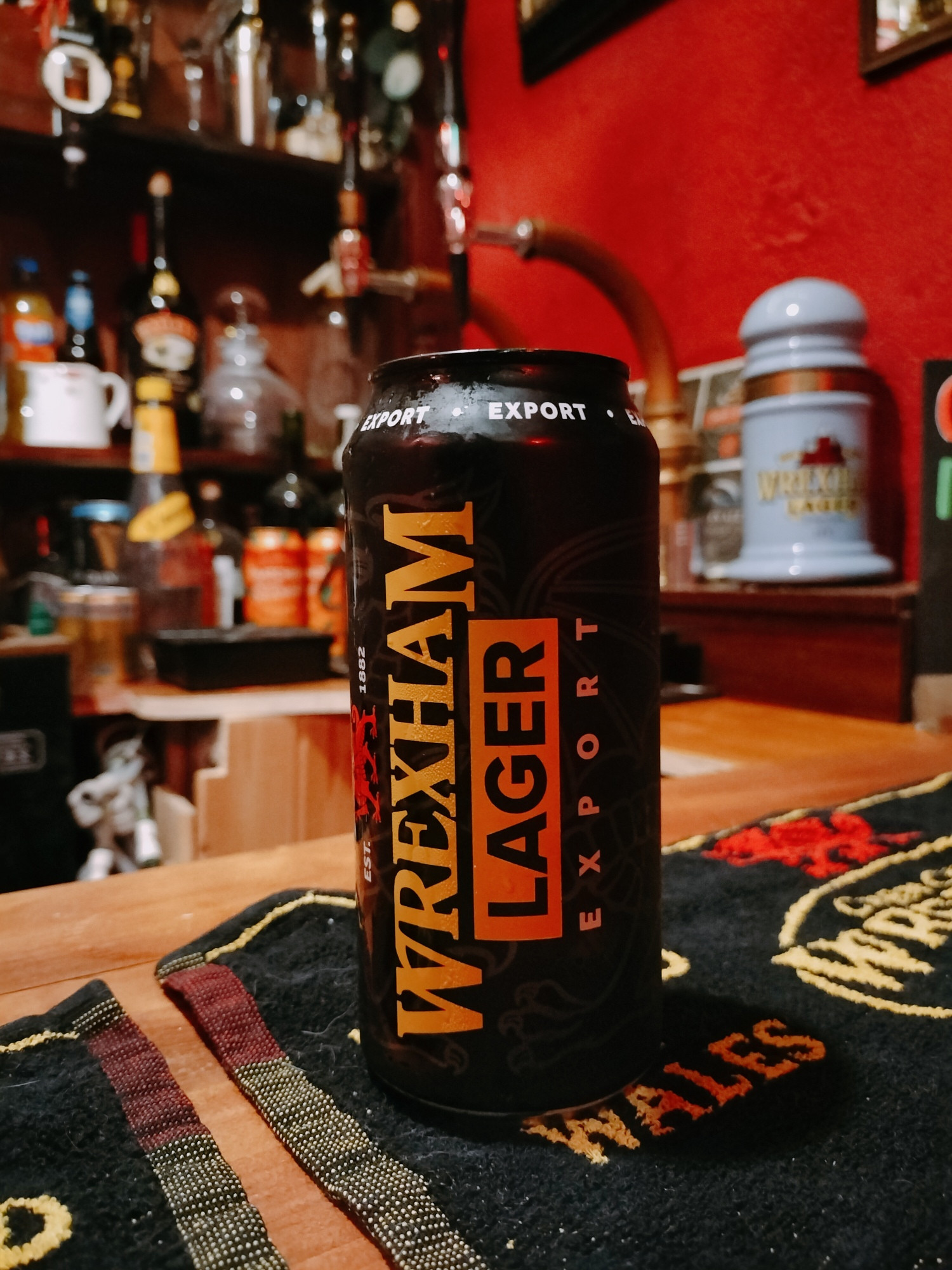 A Wrexham lager beer can on a bar