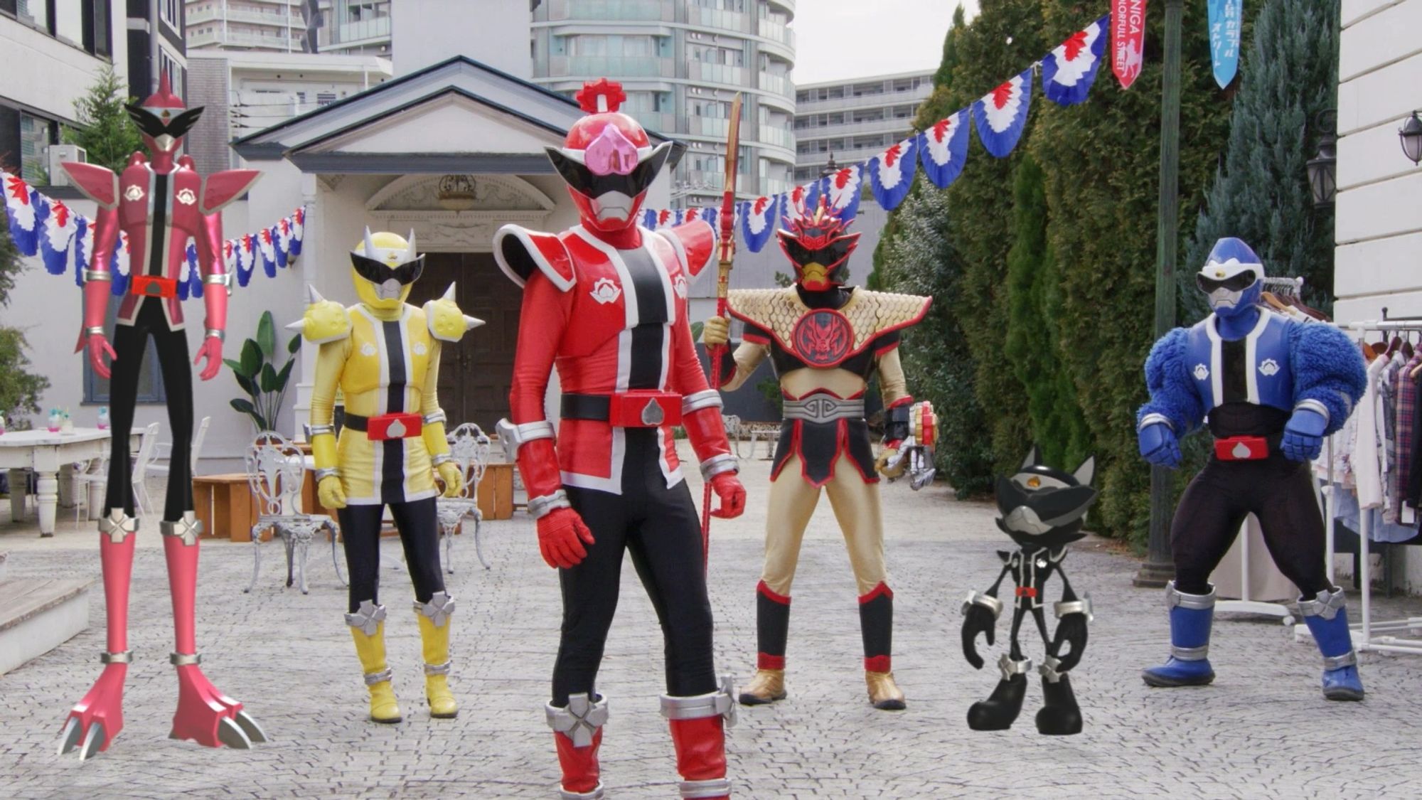 Donbrothers, a videogame avatar team featuring a red momotarou ranger with a peach on his helmet, a blue Japanese macaque ranger with bulky, hairy muscles, a yellow Oni ranger, a CGI black dog ranger with sonic-esque proportions, a CGI pink pheasant ranger with elongated legs and a gold chinese dragon ranger