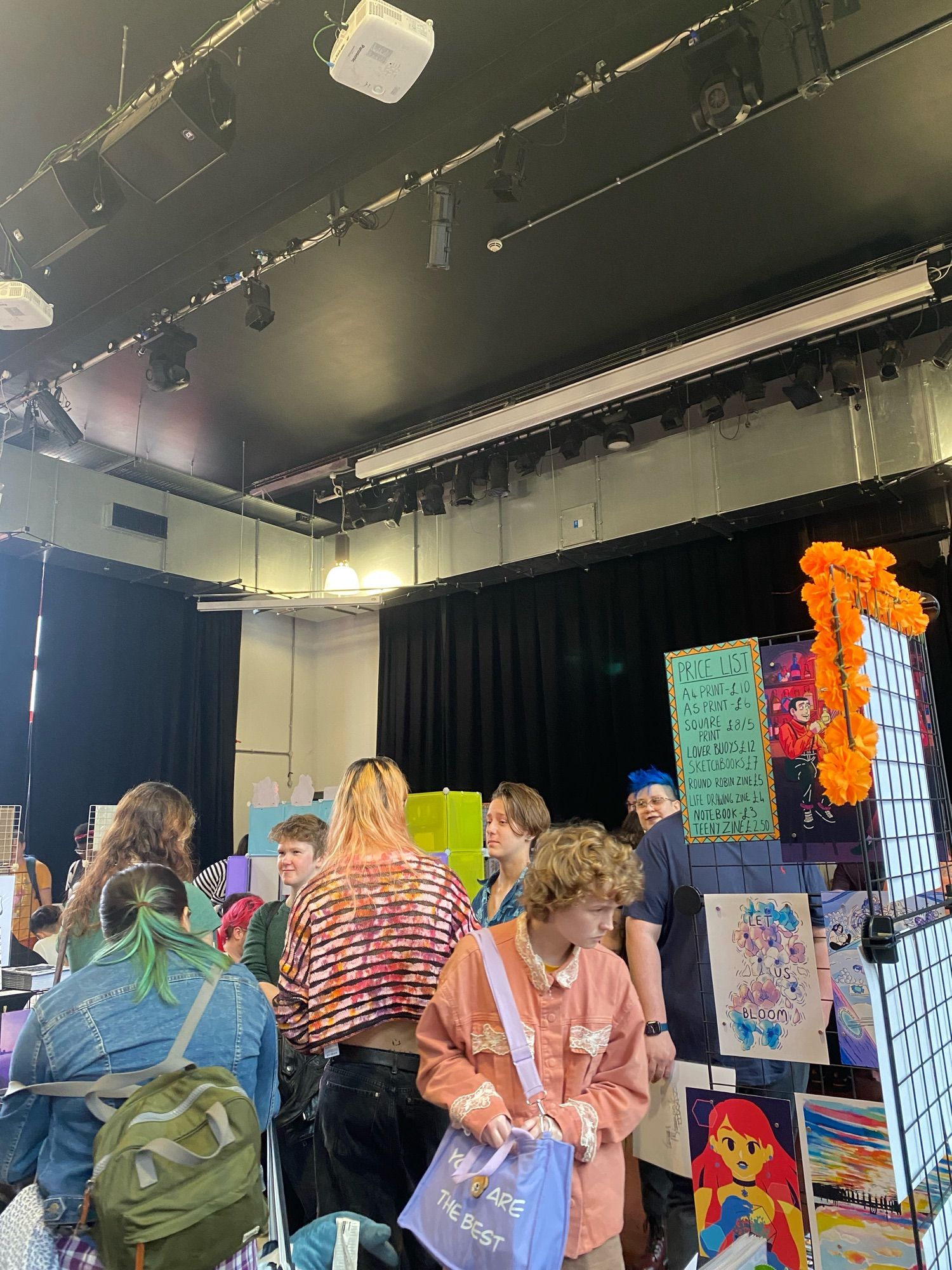 The crowd checking all the tables at PrideCaf