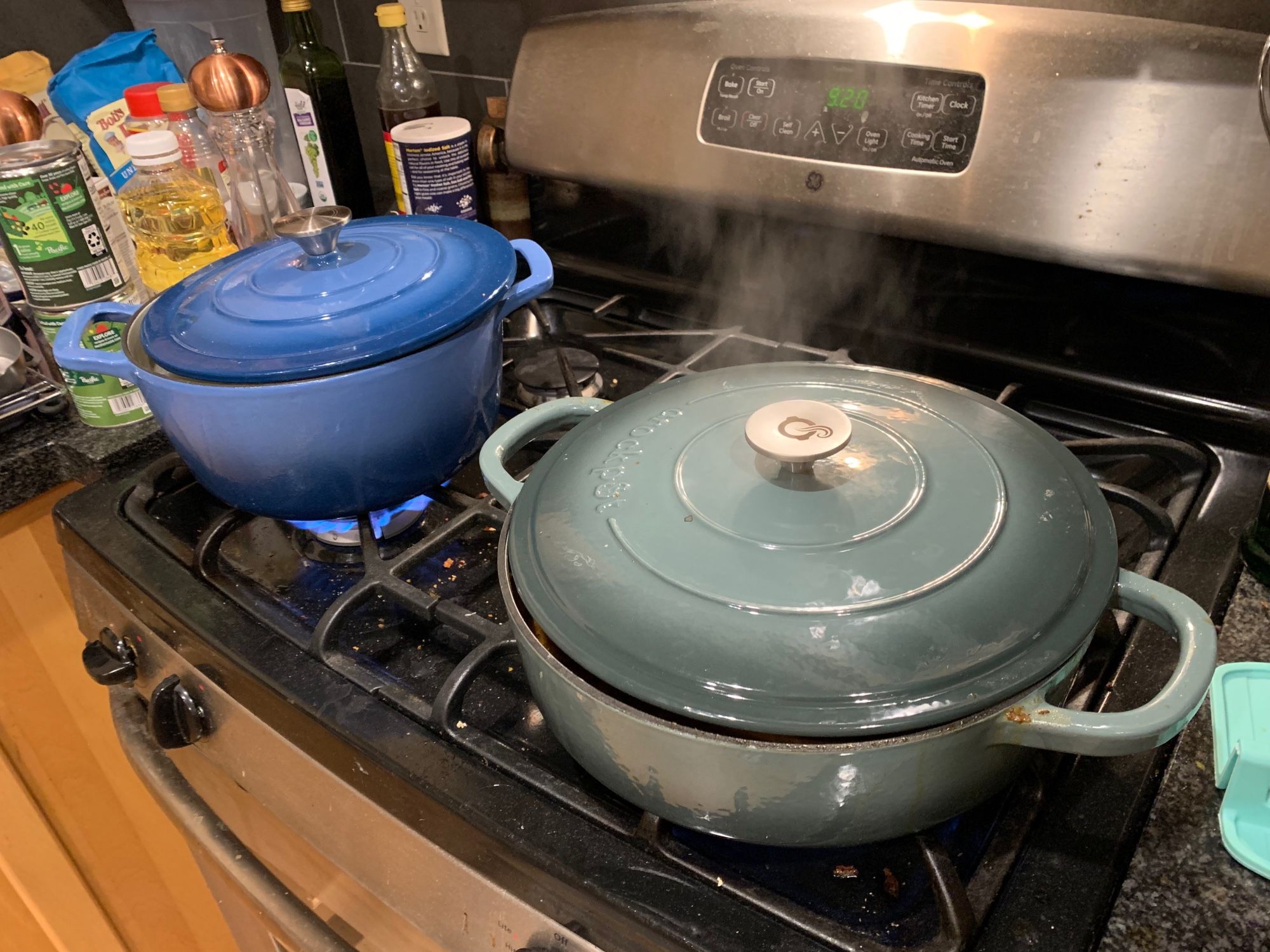 A photo of two enameled cast iron pans: a blue Dutch oven and a slate-grey braising pan. They are being used to make cottage pie