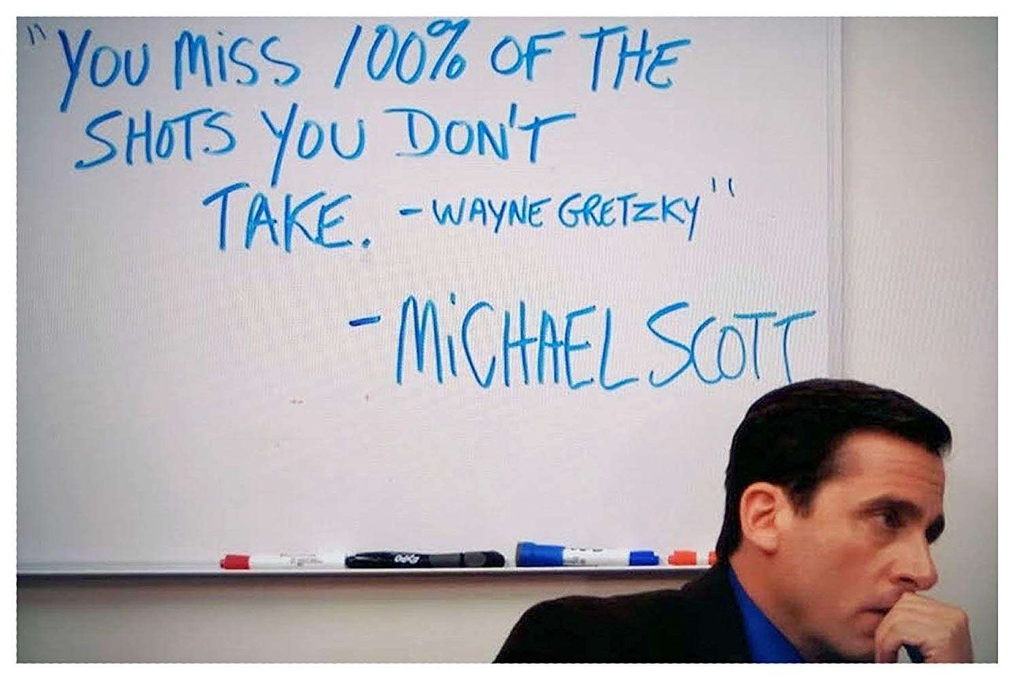 Steve Carell as Michael Scott in The Office sitting in front of a whiteboard that reads "'You miss 100% of the shots you don't take. -Wayne Gretzky' -Michael Scott"