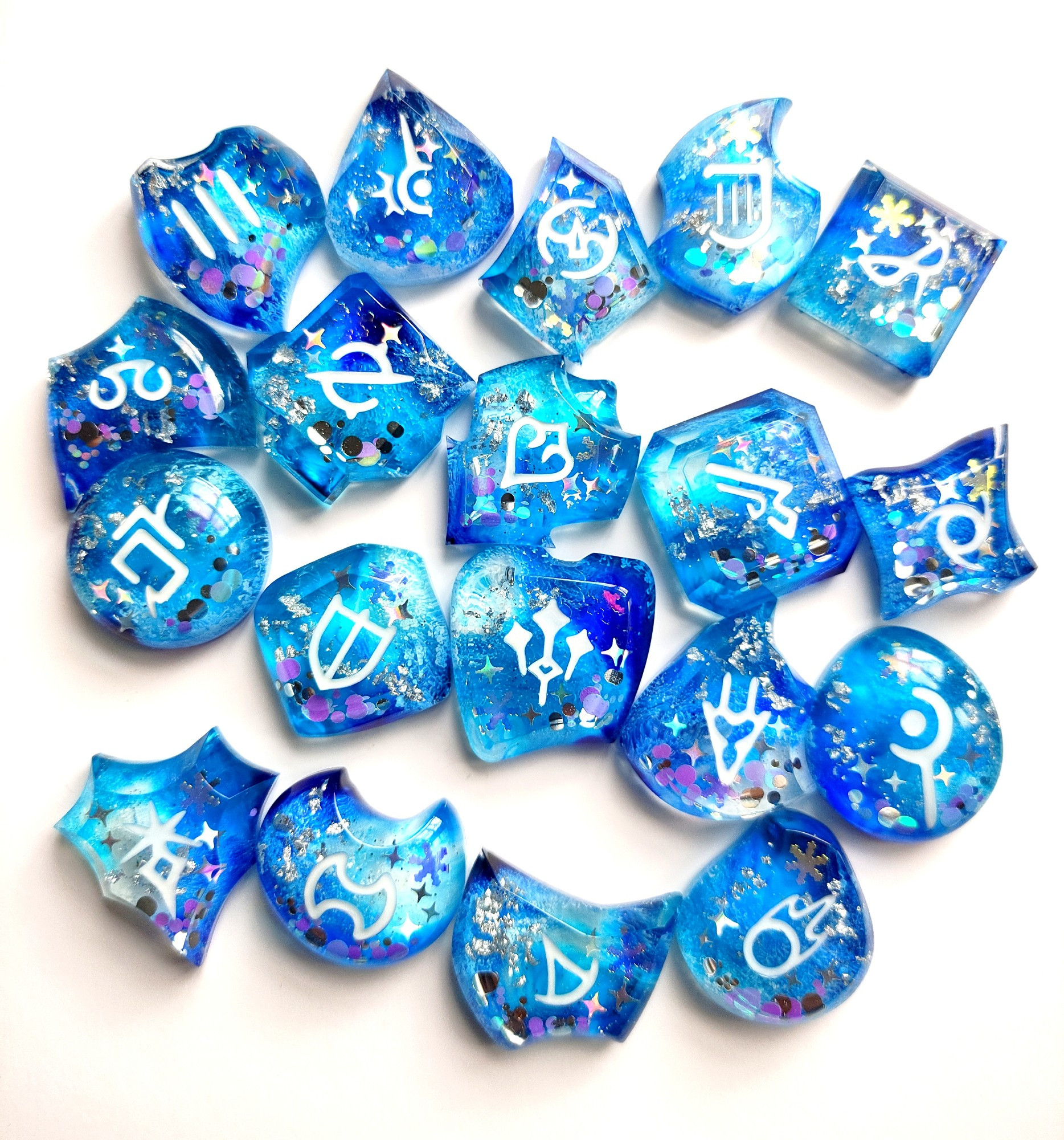 photo of job stones with the winter stars theme colored in blue and white with snowflake glitter in them