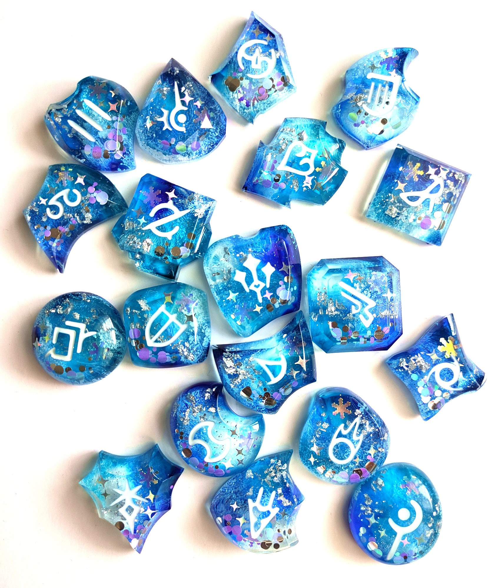 photo of job stones with the winter stars theme colored in blue and white with snowflake glitter in them