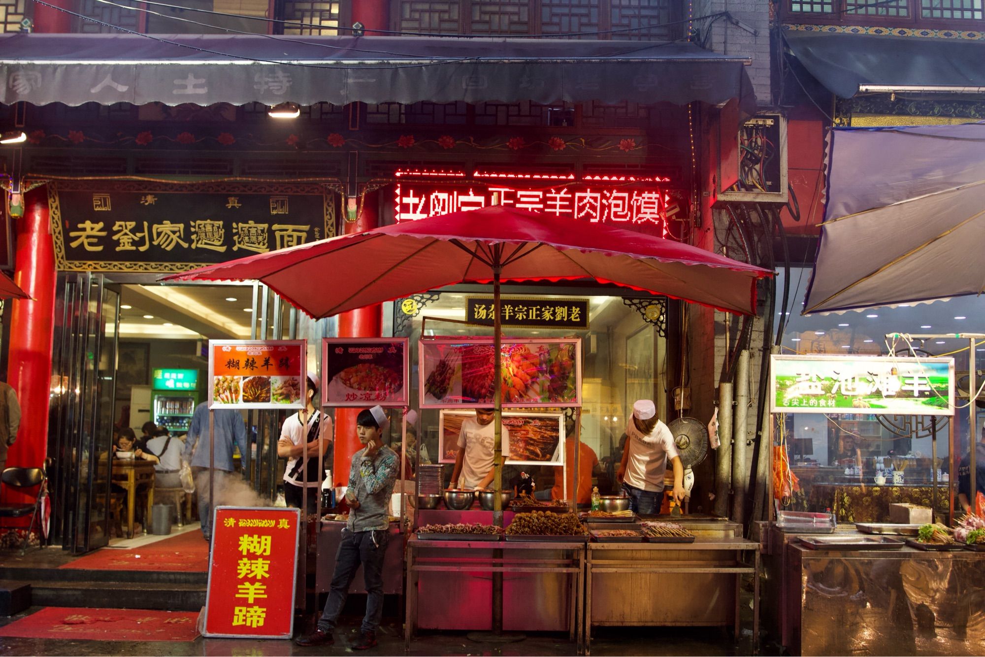 Street food vendors prepare various skewers of lamb outside Mr Liu’s, a lamb noodle restaurant in the Muslim Quarter, Xi'an.