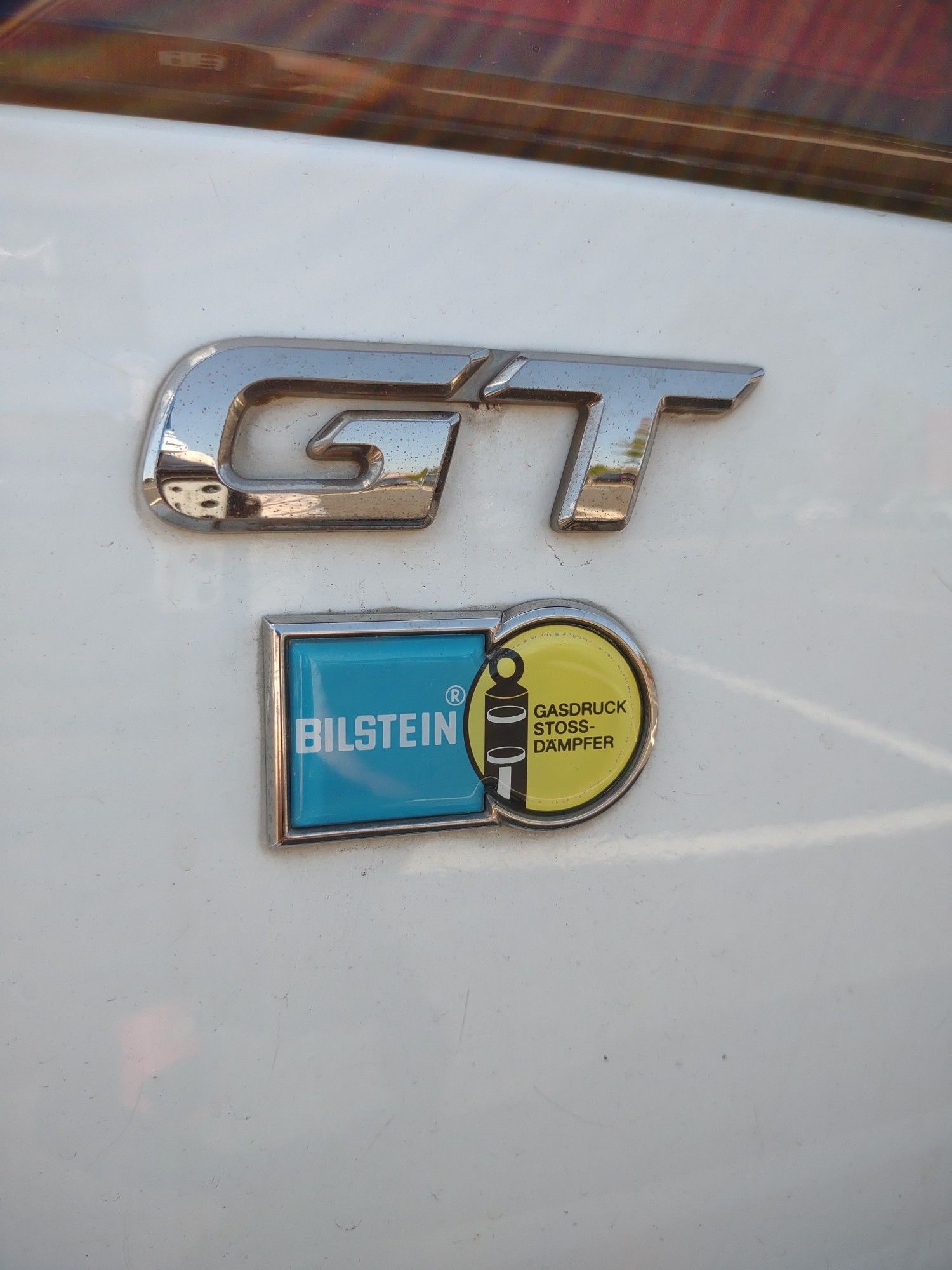 Closeup photo of the rear badges from a Subaru Legacy GT-B.