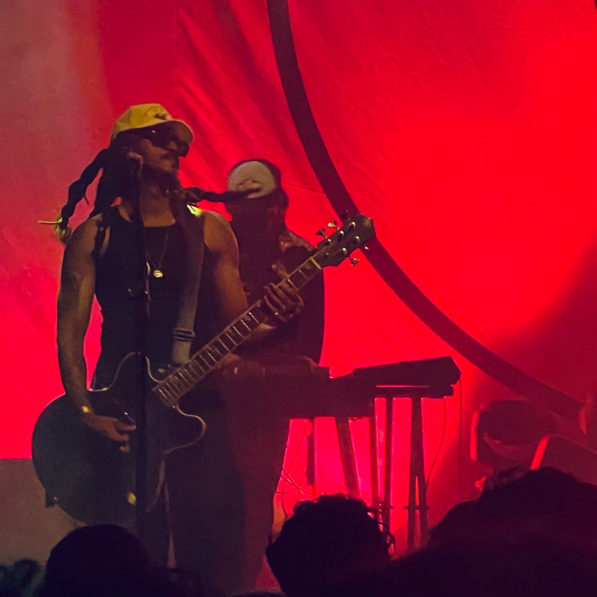 Bass player Seye Adelekan, with Vincent Taurelle in the background on keys