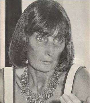Alice Recoque in B&W headshot, looking stylish in long bob with fringe