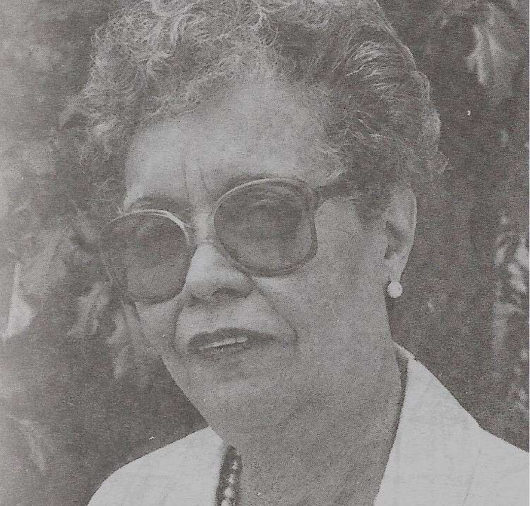 Margot Taulé in B&W photo headshot