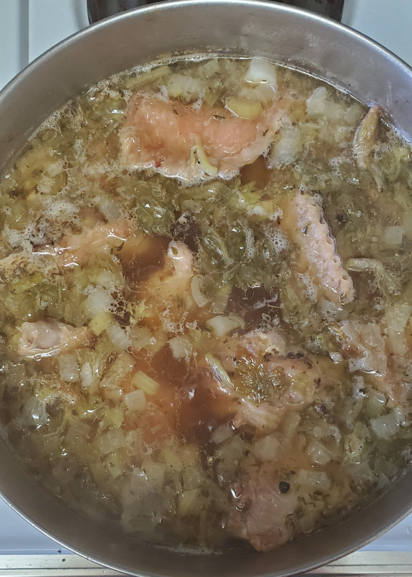 A pot of nice brown turkey stock, simmering on the stove.