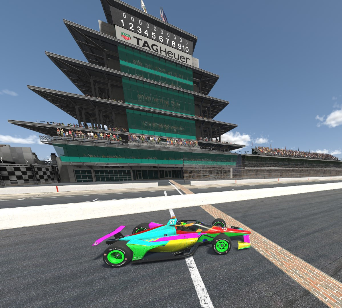 Jason Fellenbaum's Template paint scheme, a combination of many colors on each part of the car, used to help painters know which piece they are painting, sits on the yard of bricks in front of the IMS pagota victorious.