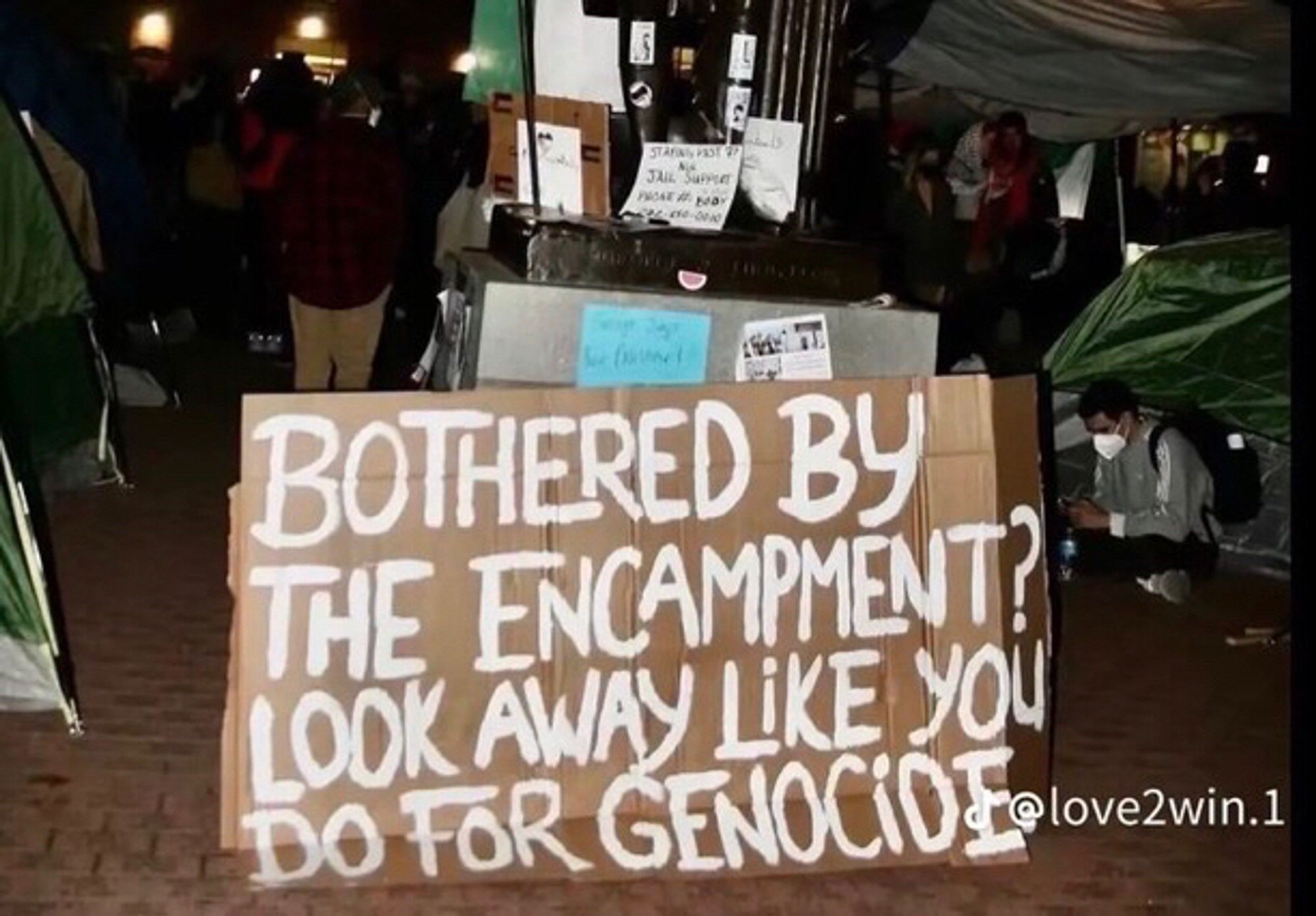 Sign from love2win.1 on TikTok: bothered by the encampment? Look away like you do for genocide