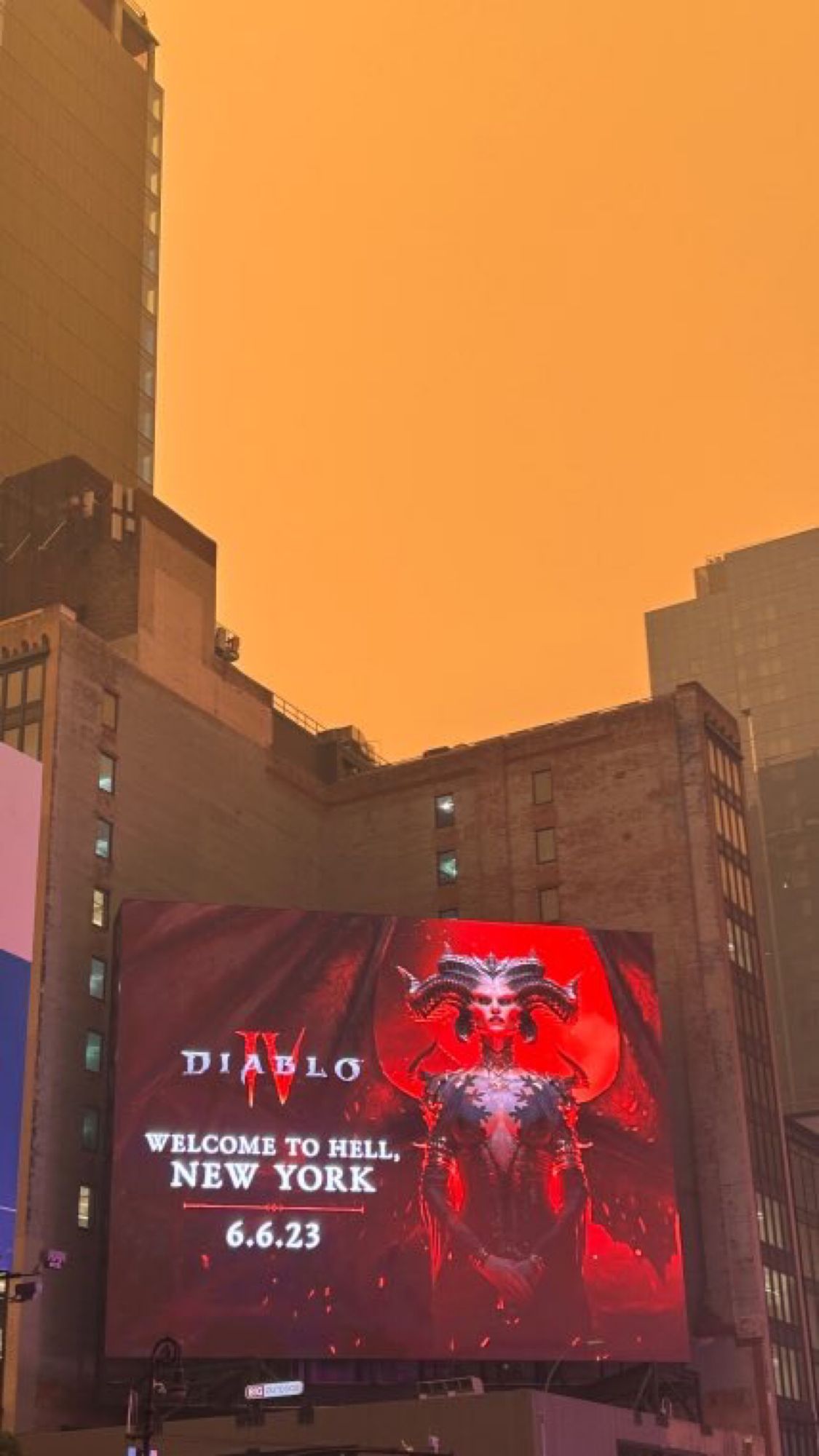 Current nyc hazy apocalypse Skyline with a Diablo IV sign saying New York City welcome to hell 