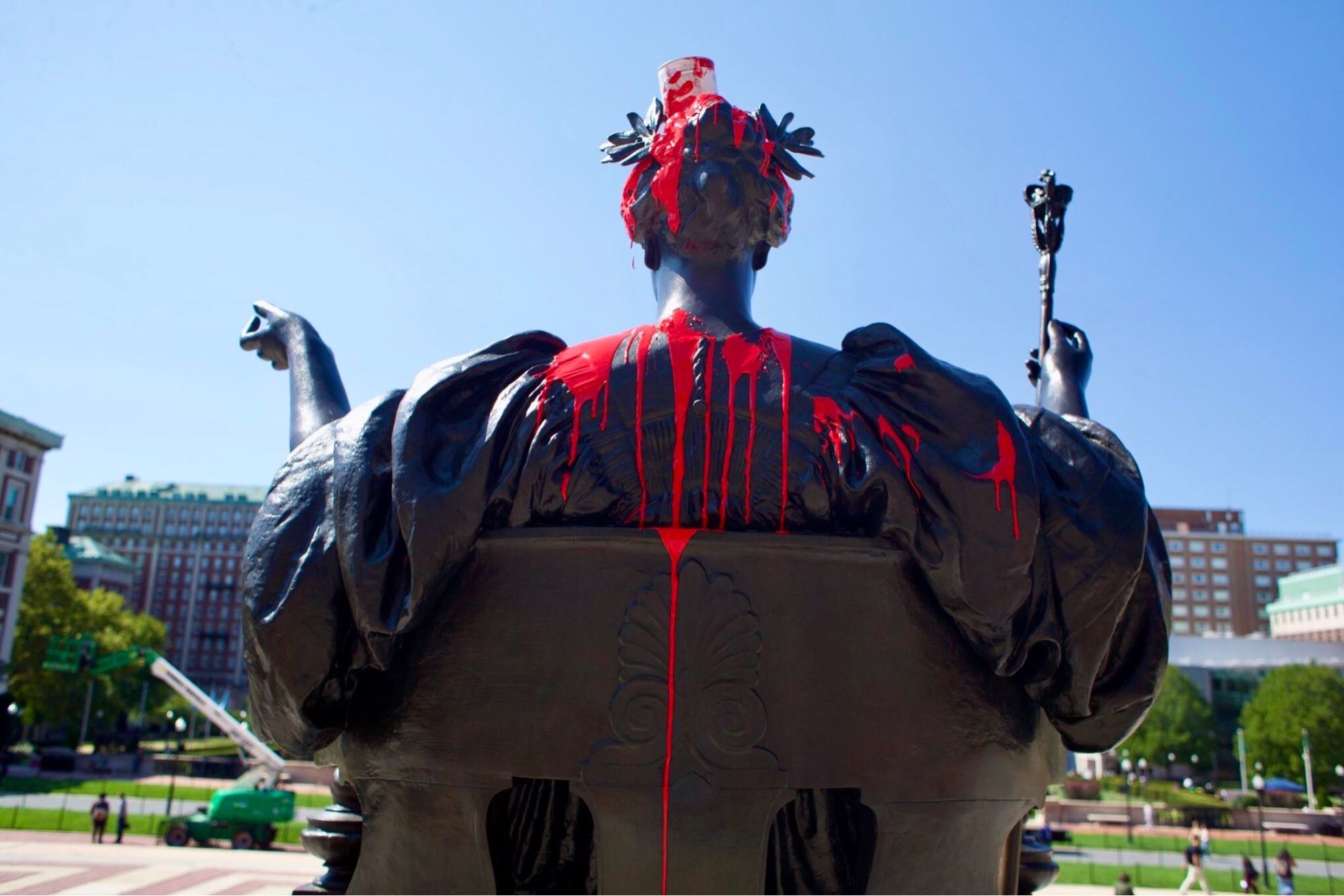 Photo of the dripping red paint on the back of the statue