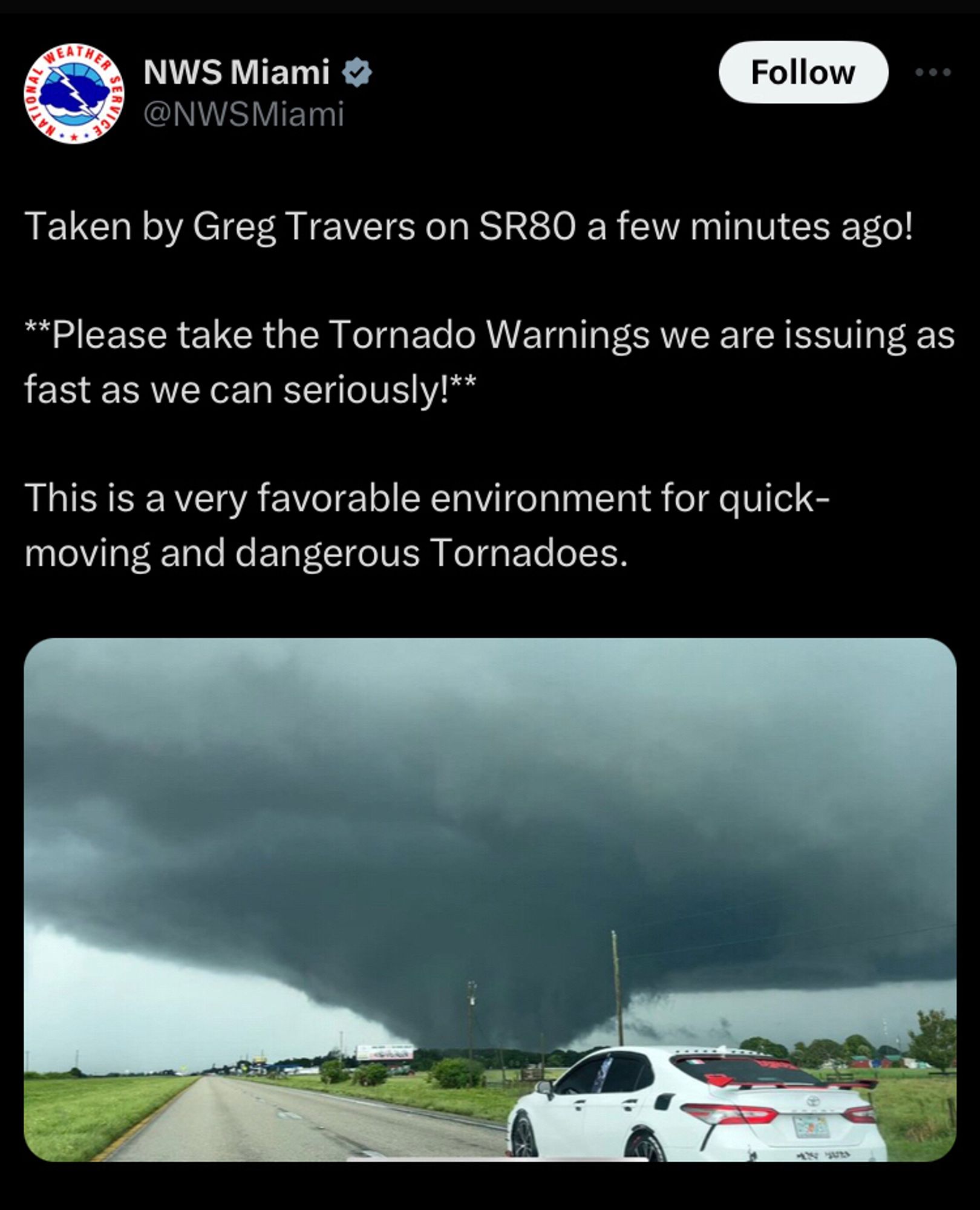 NWS Miami posting a photo of a massive tornado- Taken by Greg Travers on SR80 a few minutes ago! 

**Please take the Tornado Warnings we are issuing as fast as we can seriously!**

This is a very favorable environment for quick-moving and dangerous Tornadoes.