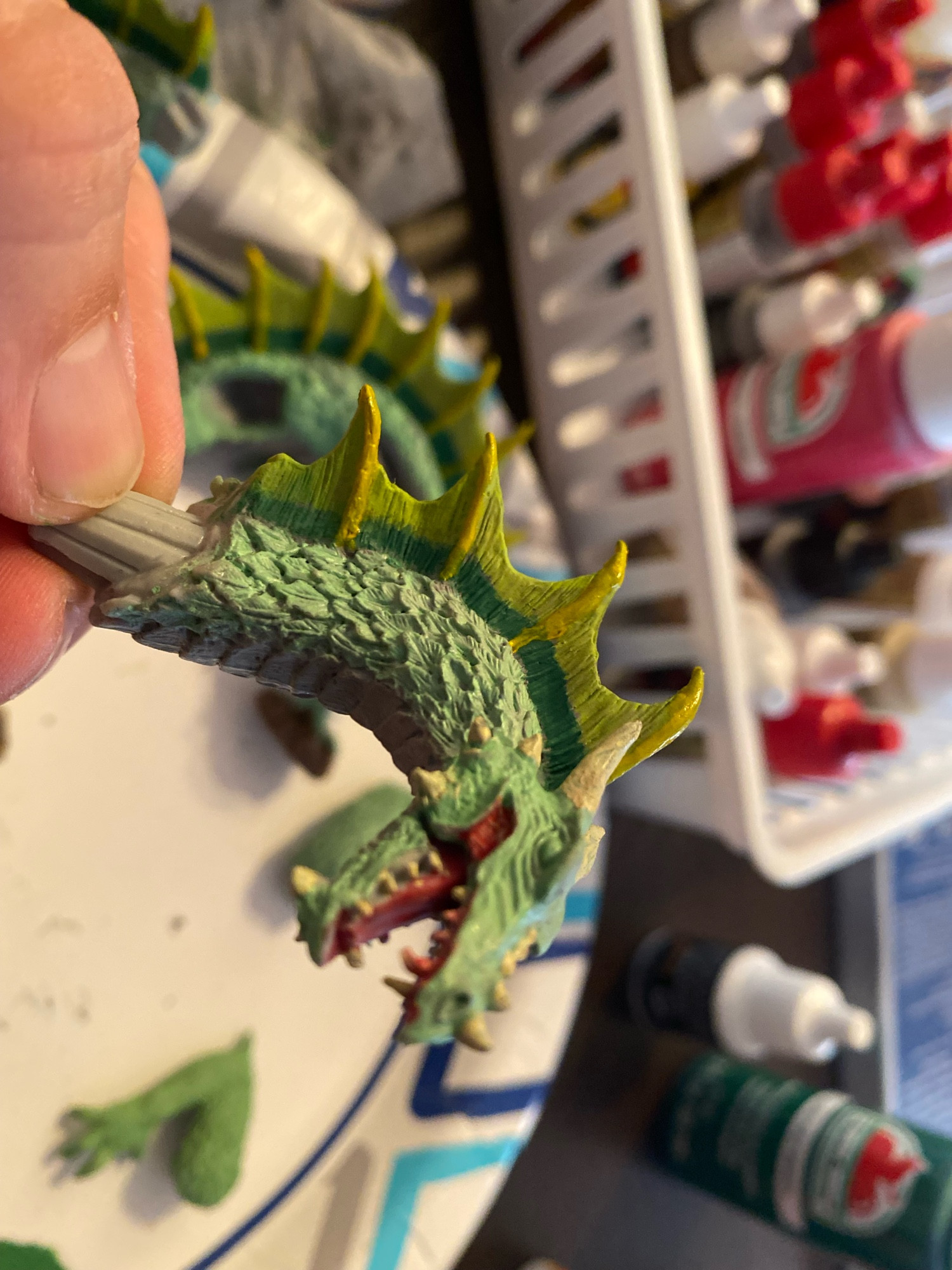 Green dragon head. Yellow-green horns. Scales individually painted with green and an army green wash