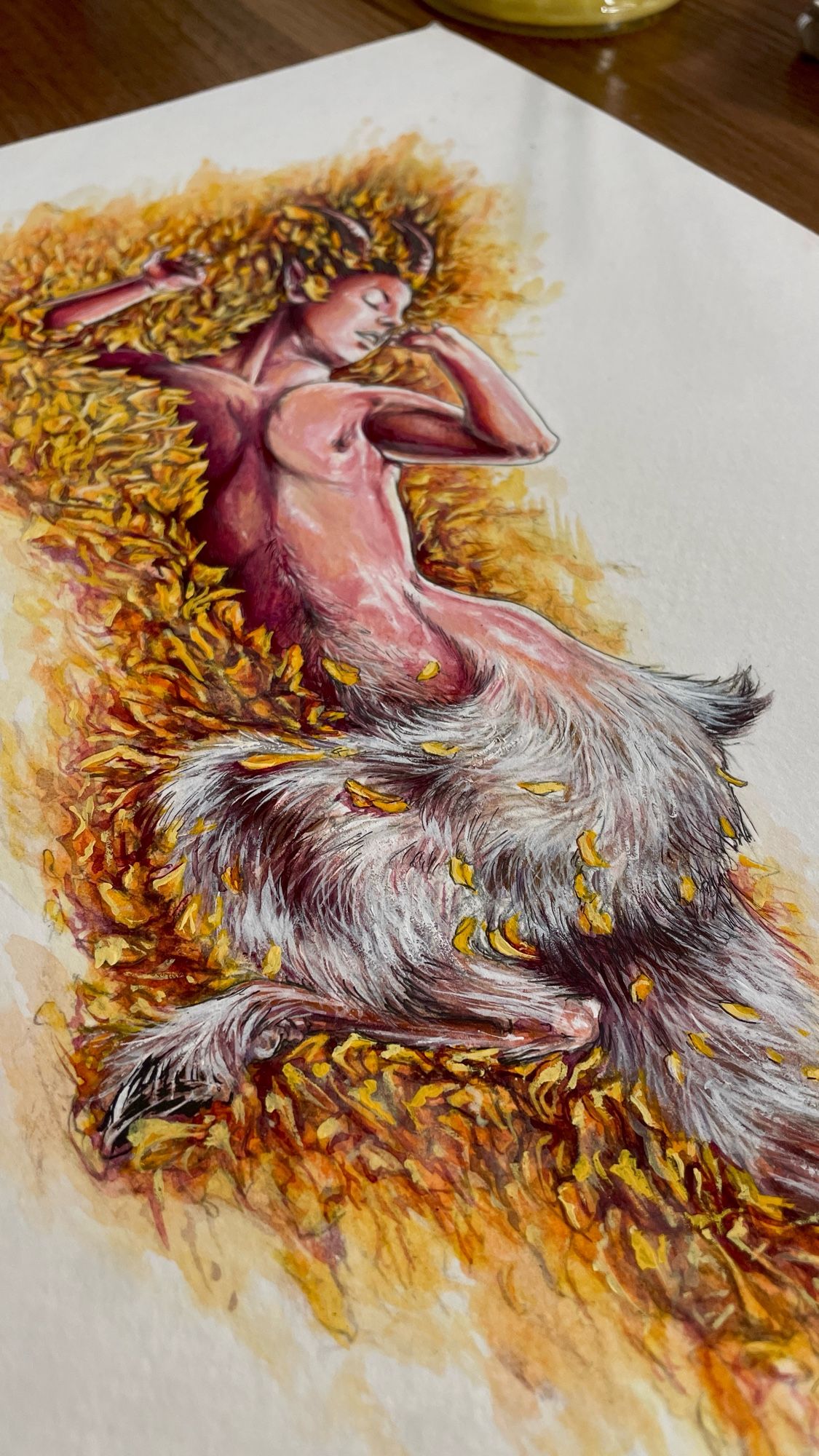 wip photo of a gouache and ink painting of a satyr in some autumn leaves because zev wants it to be real fall already

all i had was hot press, YES it has been a Struggle, NO i am not asking for peer review at this time!!!