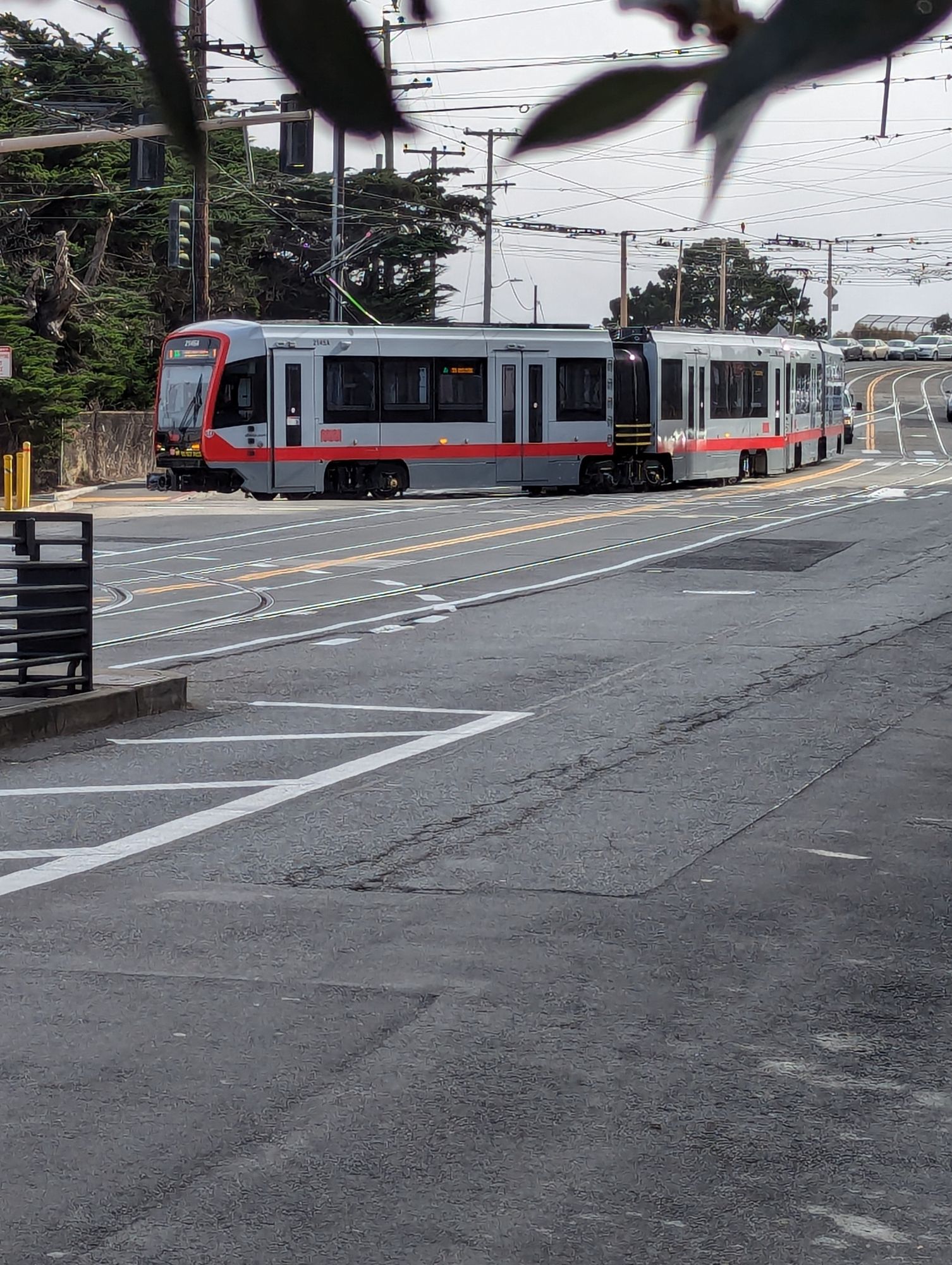 A light rail vehicle partly turned into a rail yard (not next to a platform)