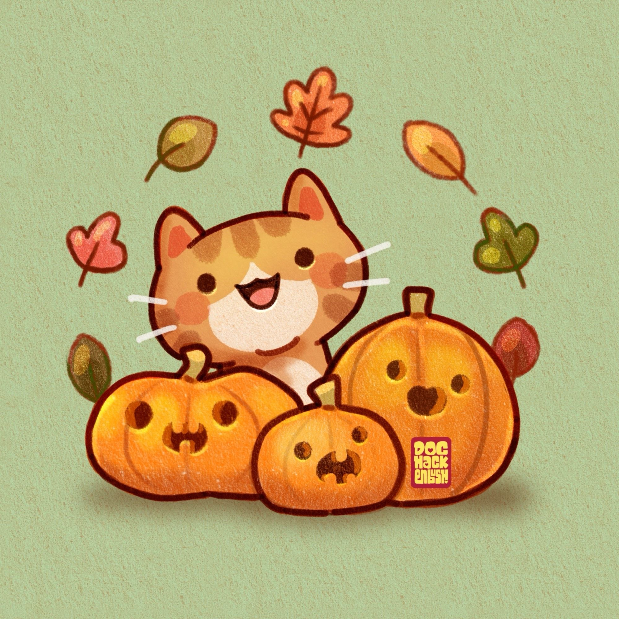 A smiling ginger kitty poking his head out from behind three cute pumpkins with Jack o’lantern faces, circled by a wreath of autumnal leaves