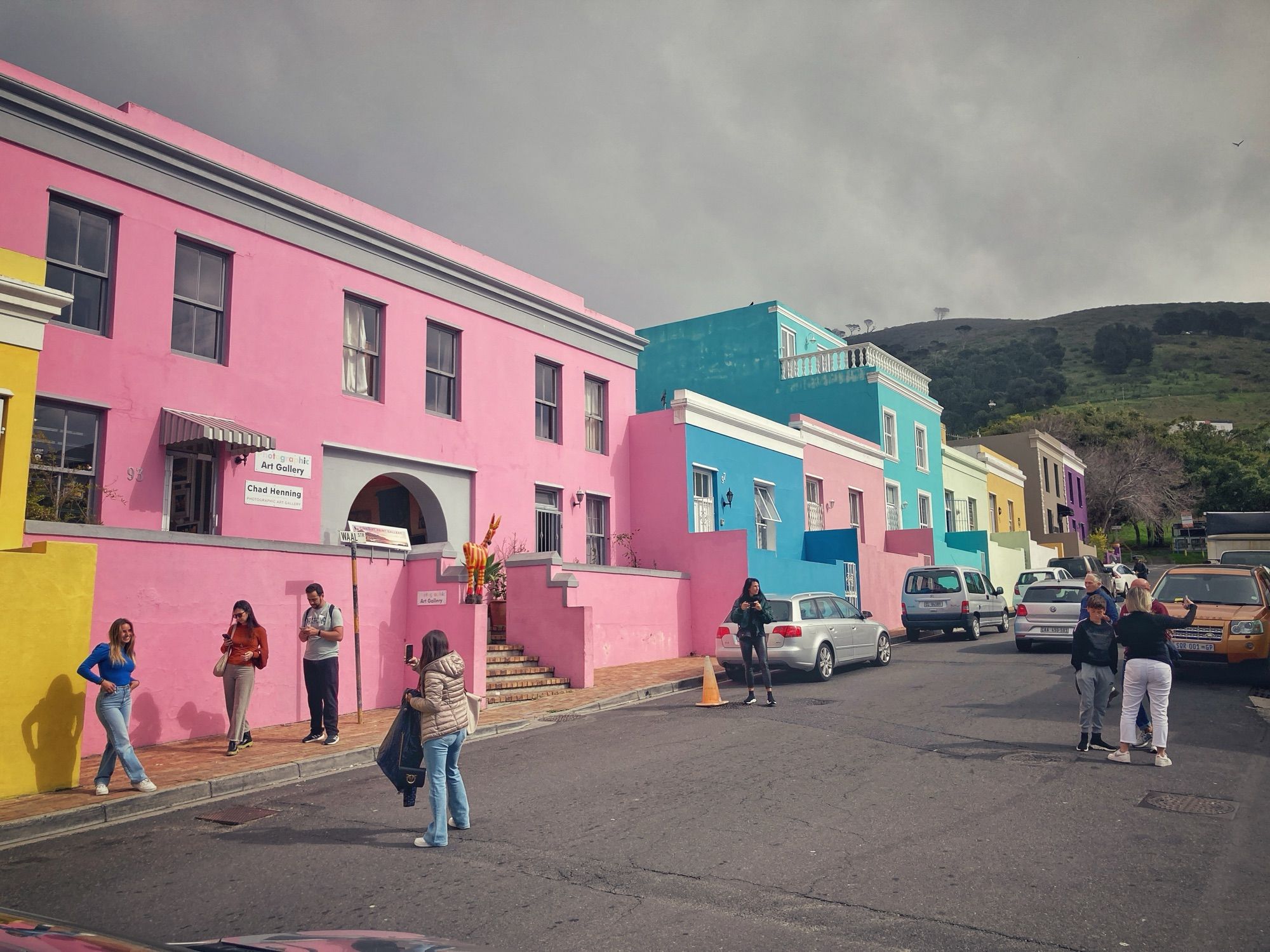 People queue to have their photos taken in front of the brightly coloured houses in Bo-Kaap, Cape Town.