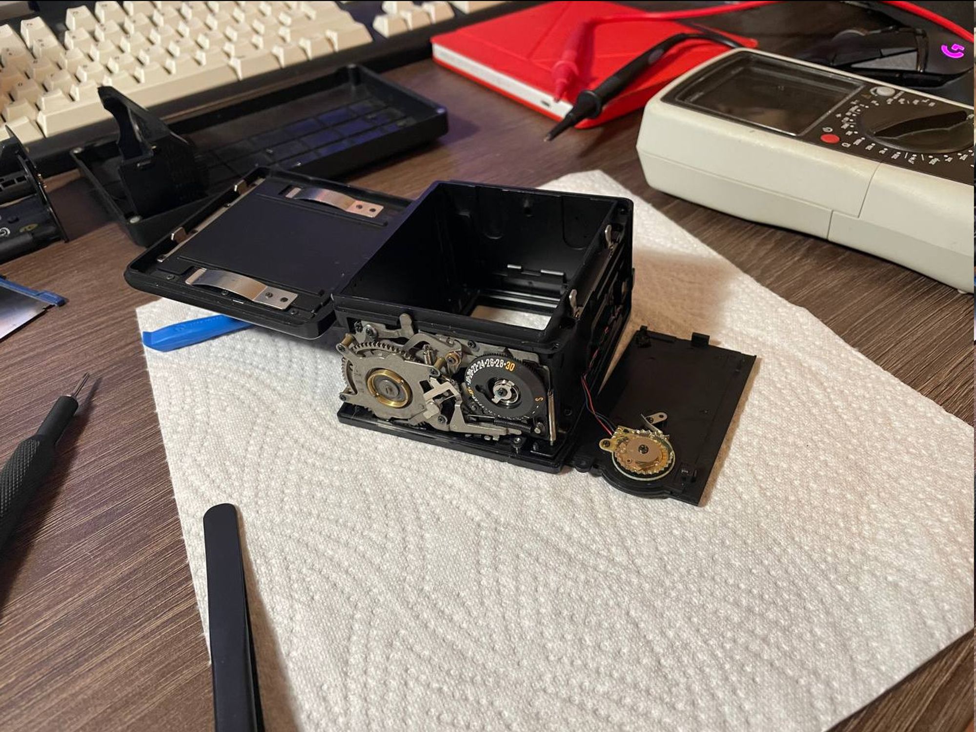 mamiya 645 n film back with side panels removed, undergoing repairs